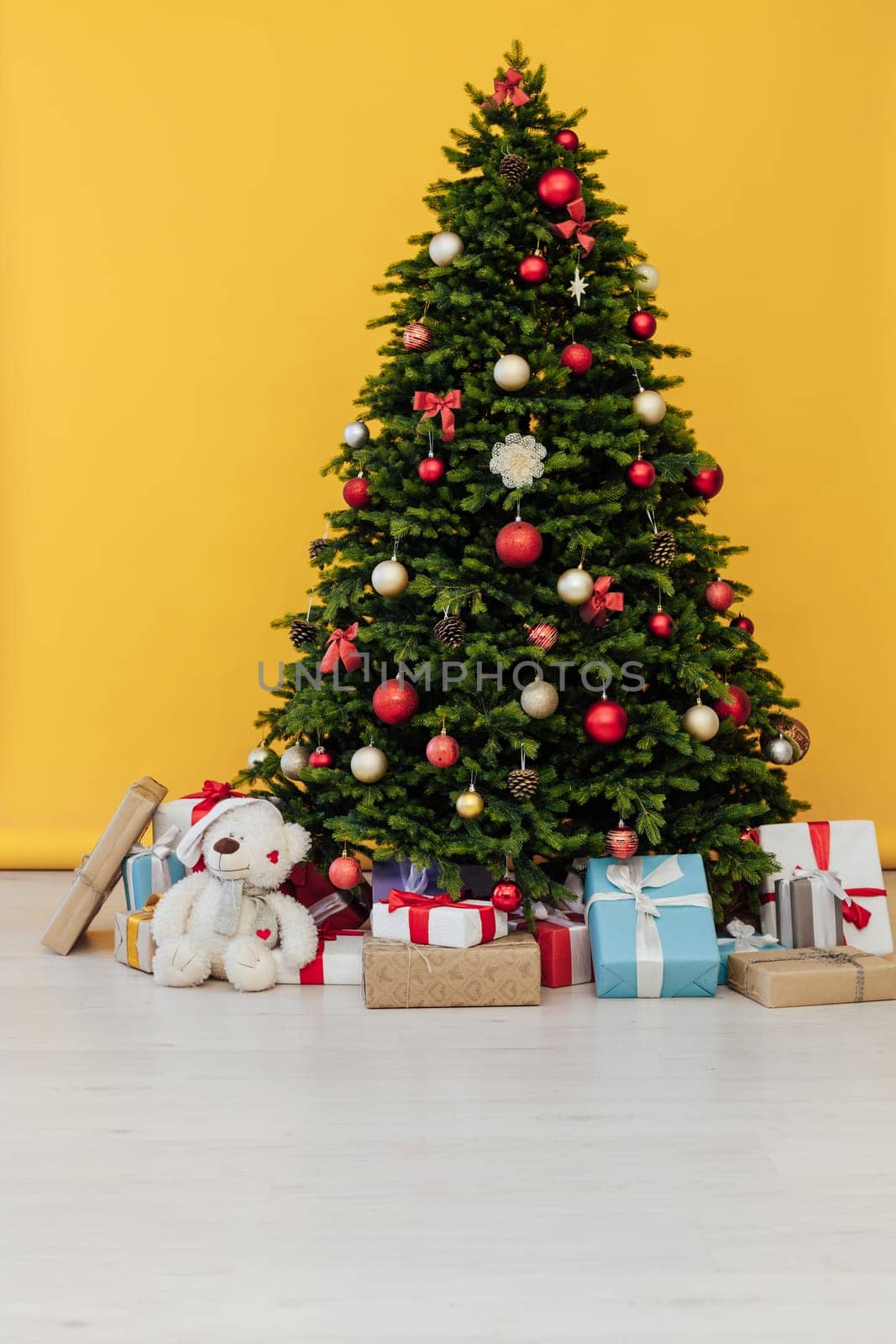 Christmas tree with presents underneath in living room