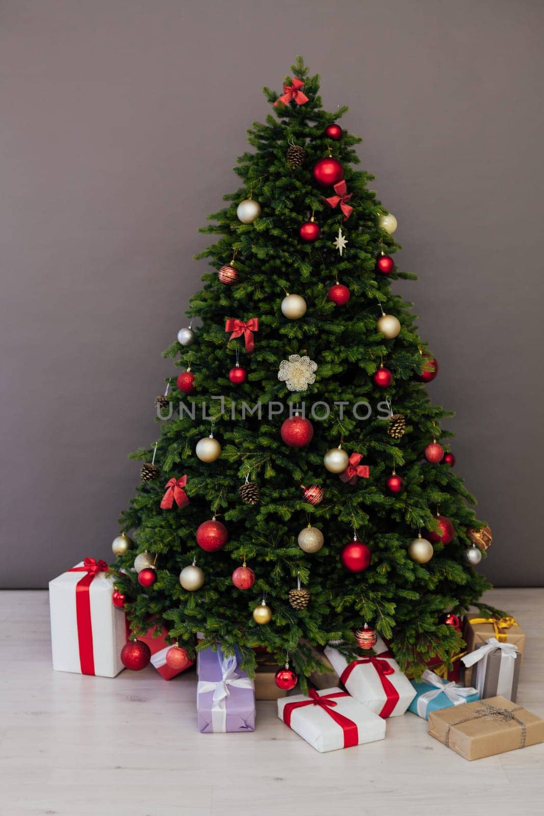 Christmas tree with presents underneath in living room