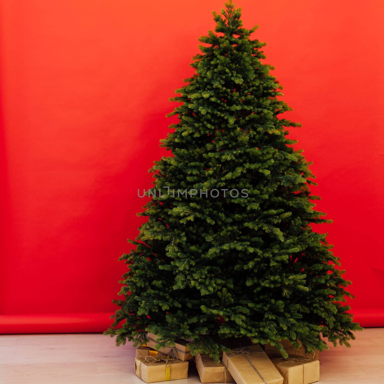 Beautiful holdiay decorated room with Christmas tree with presents