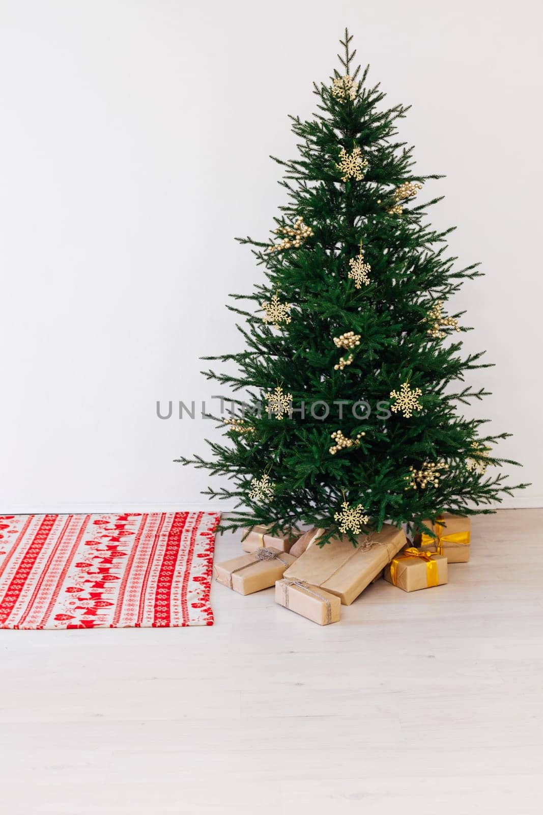 Beautiful decorated room with Christmas tree with presents under it. New year background