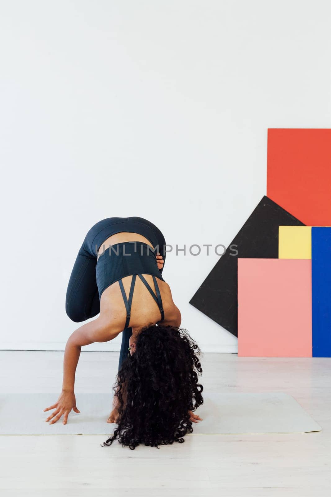 brunette woman engaged in yoga asana gymnastics fitness flexibility body