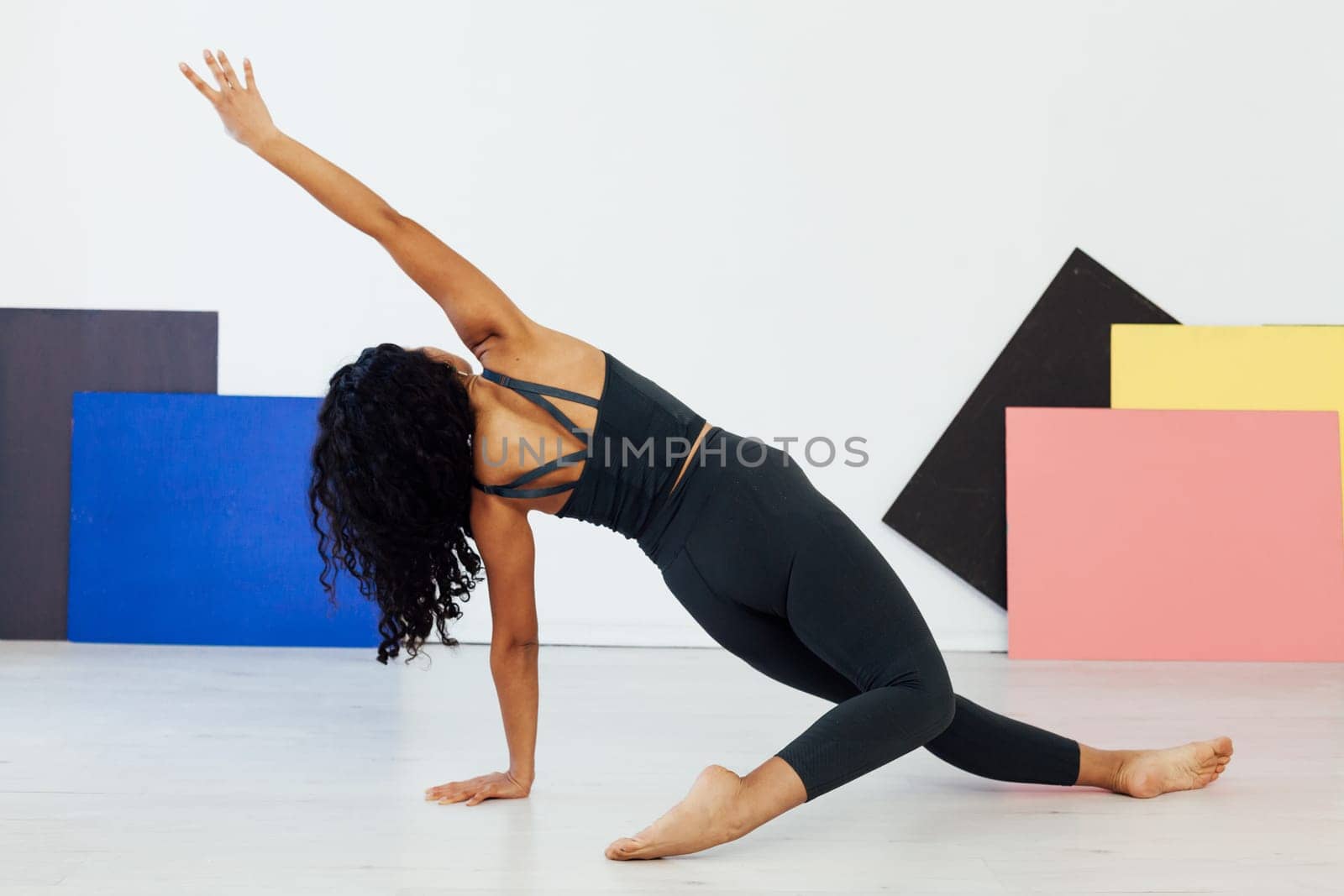 Beautiful woman engaged in yoga asana gymnastics fitness flexibility body sport