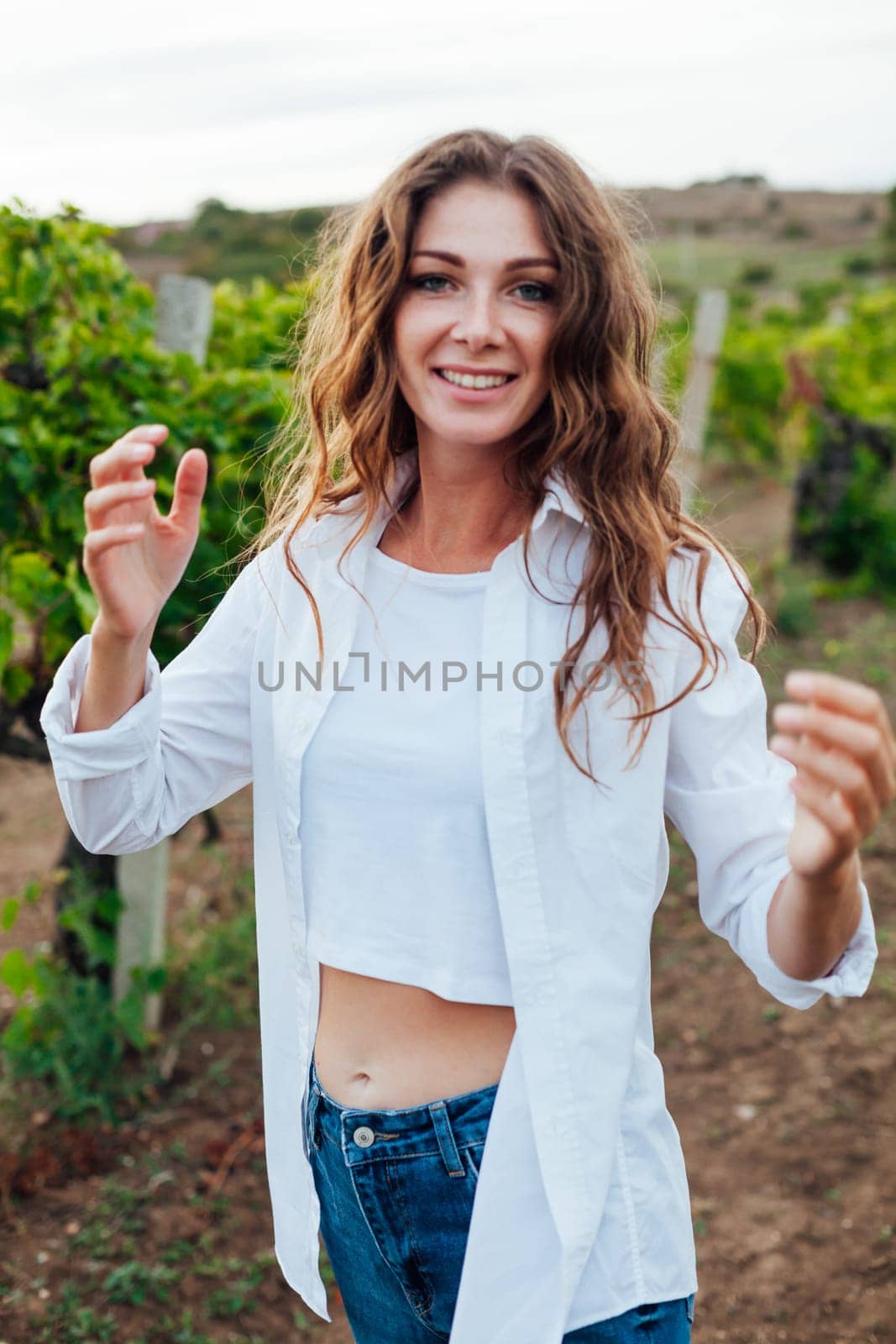 fashionable woman in the vineyards for wine