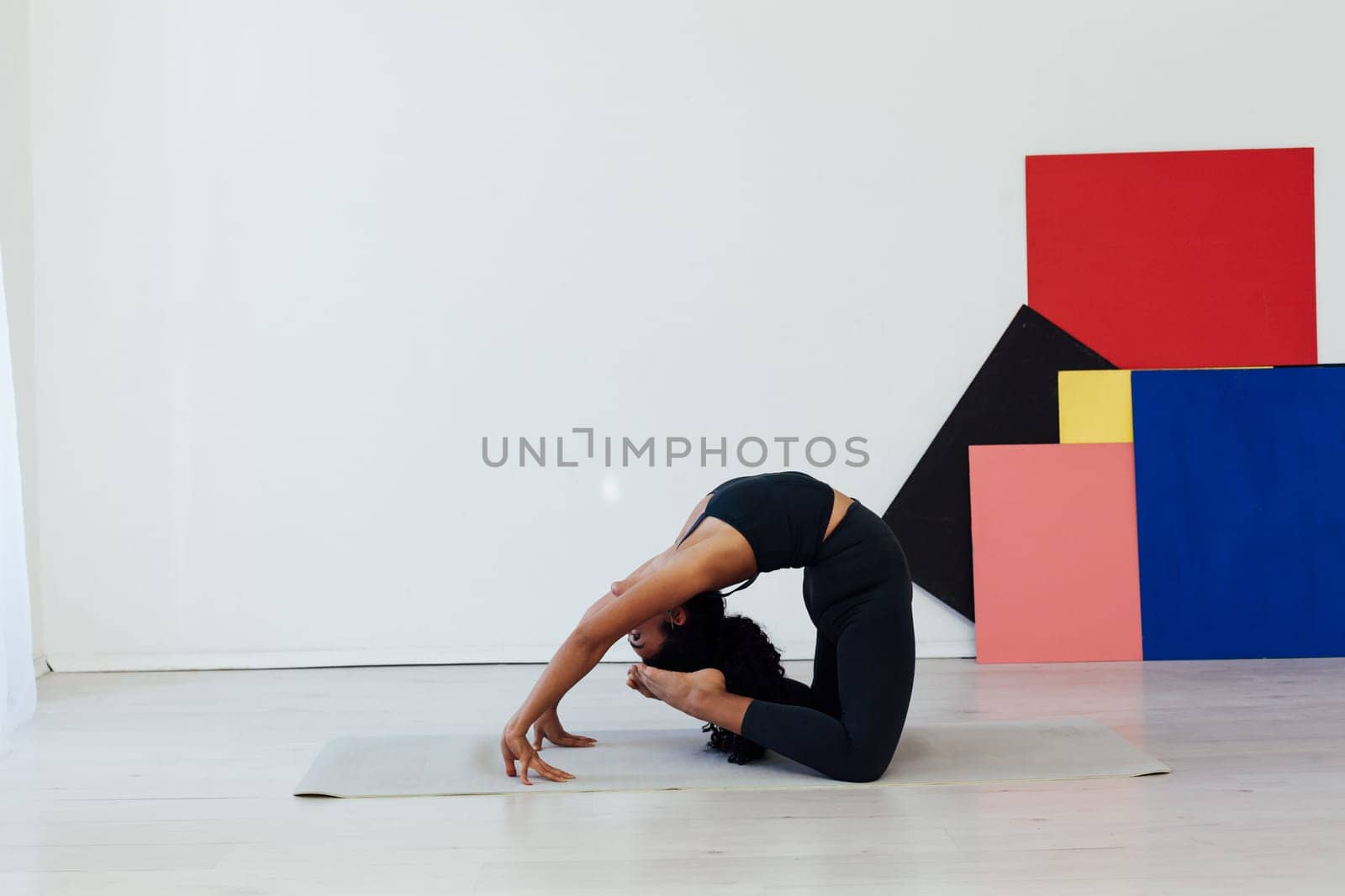 Beautiful flexible fitness woman yoga asana gymnastics body flexibility