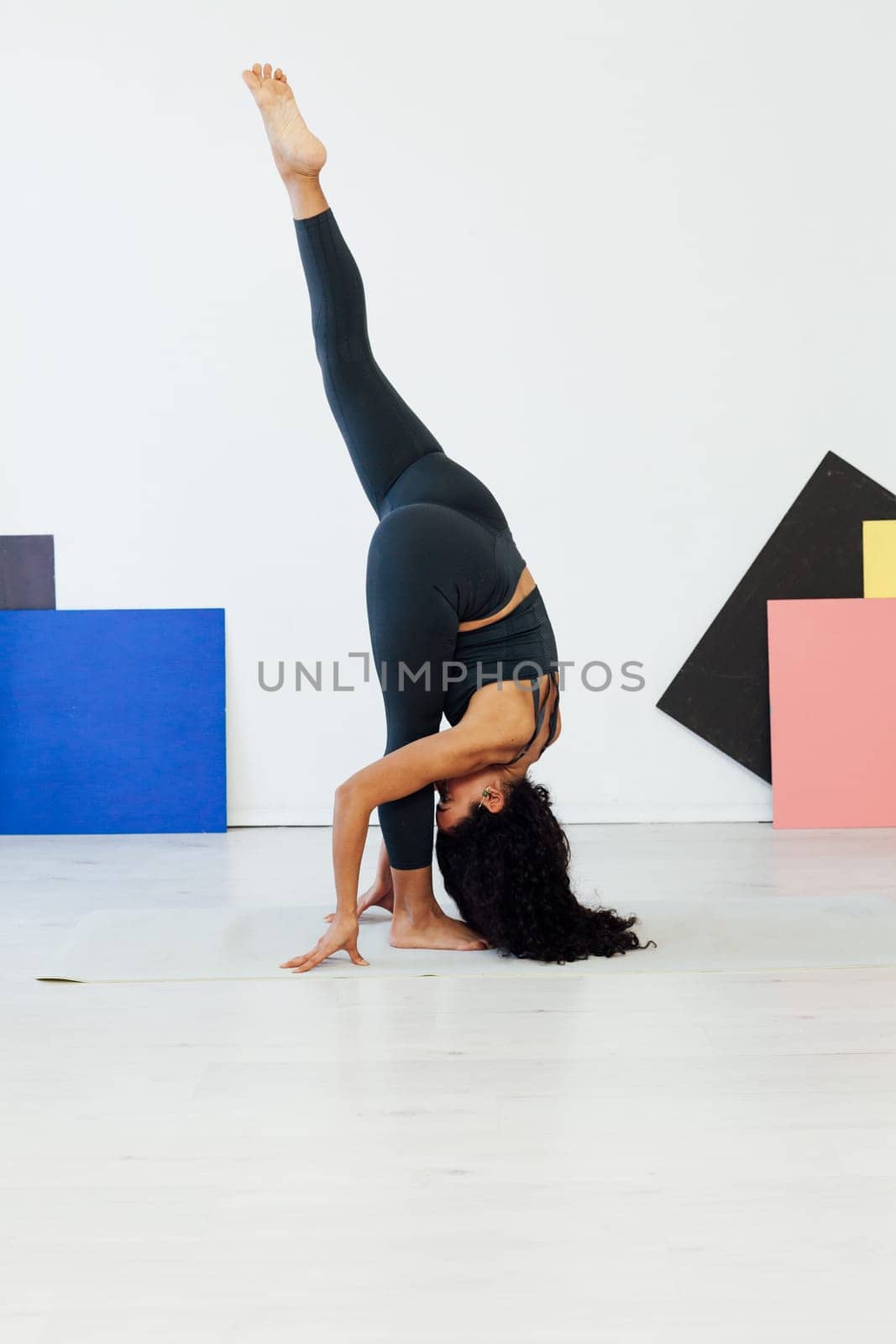 Beautiful flexible fitness woman yoga asana gymnastics body flexibility