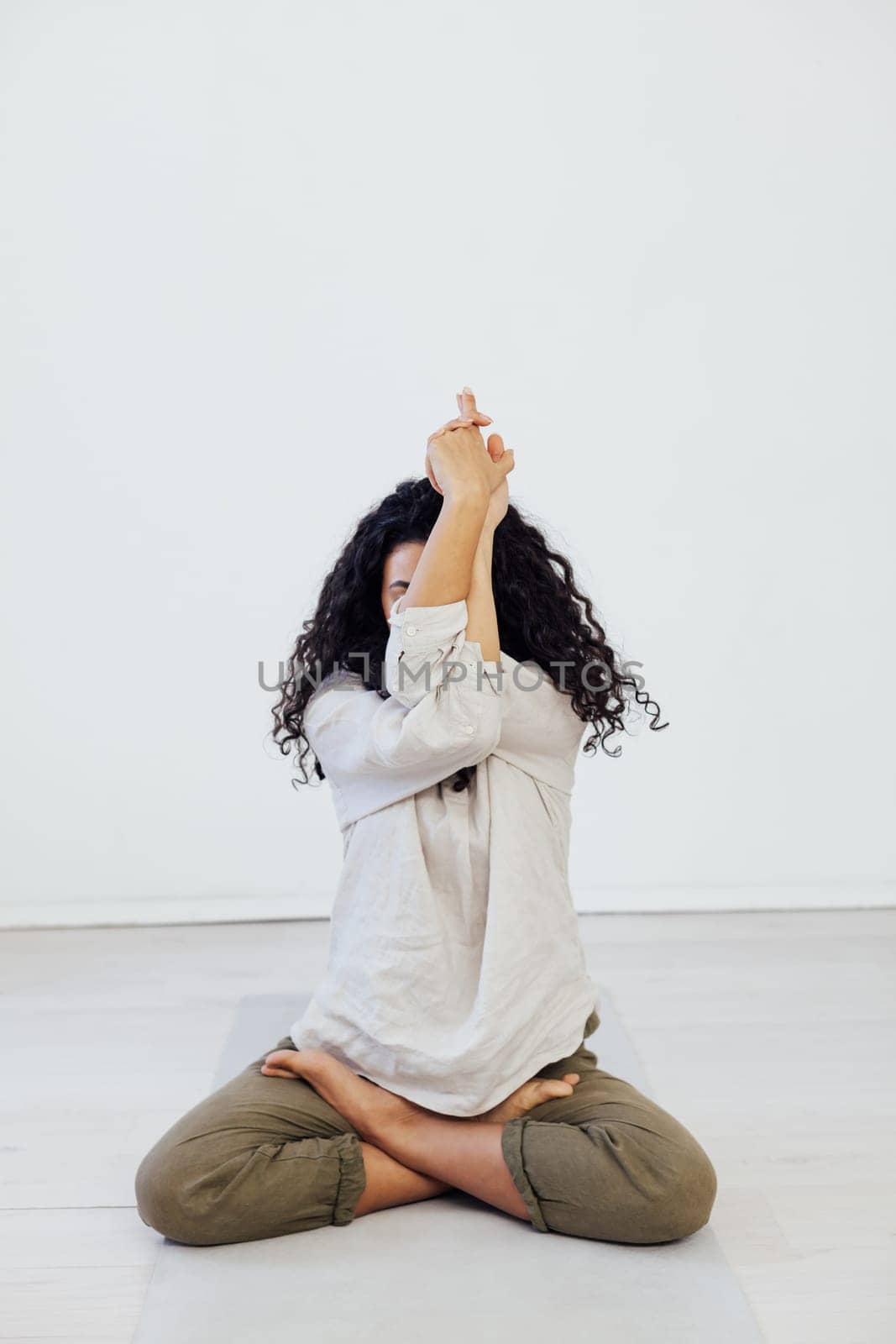 Beautiful woman yoga asana gymnastics body flexibility by Simakov