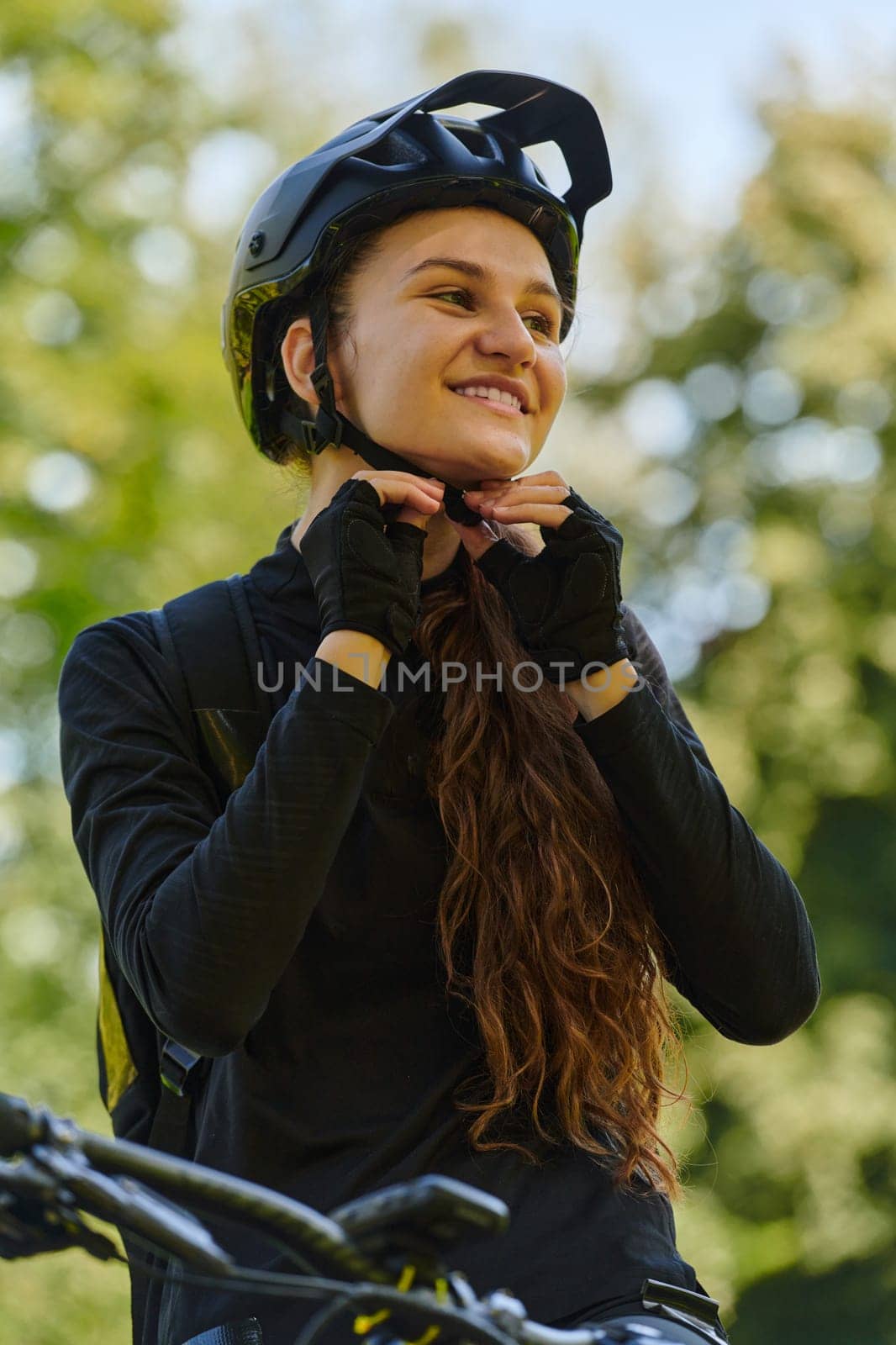 In the radiant embrace of a sunny day, a joyous girl, adorned in professional cycling gear, finds pure bliss and vitality as she cruises through the park on her bicycle, her infectious laughter echoing the carefree harmony of the moment.