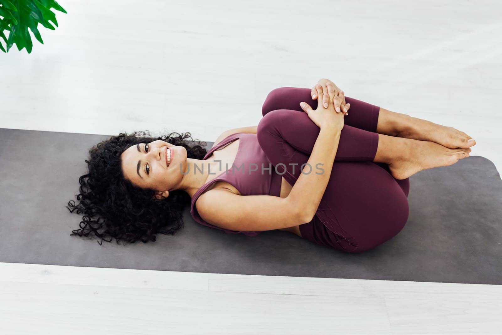 Beautiful woman yoga asana fitness sport gym by Simakov