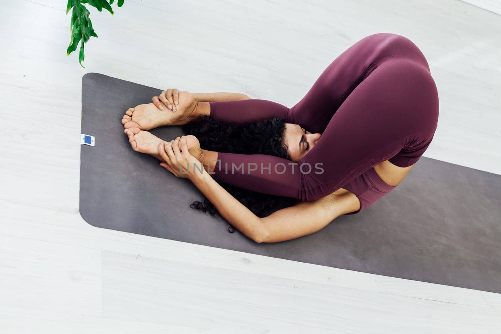 Beautiful woman yoga asana fitness sport gym by Simakov
