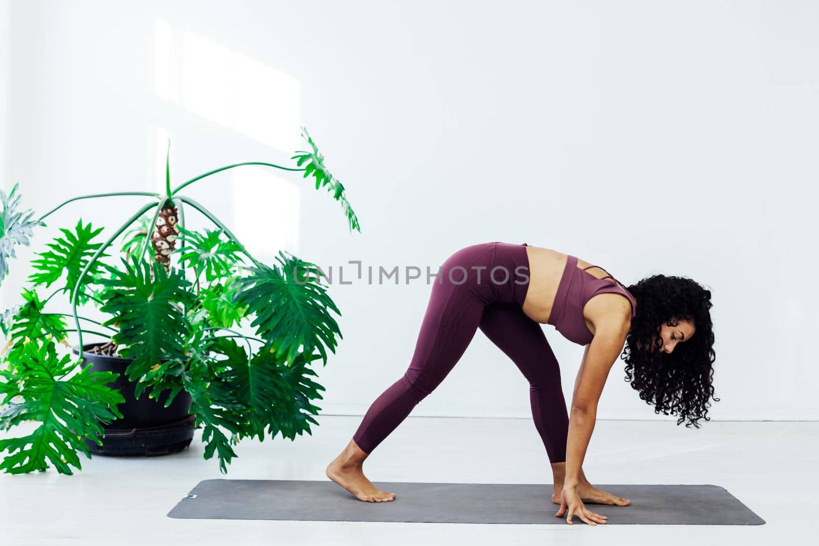woman yoga asana engaged in fitness gym