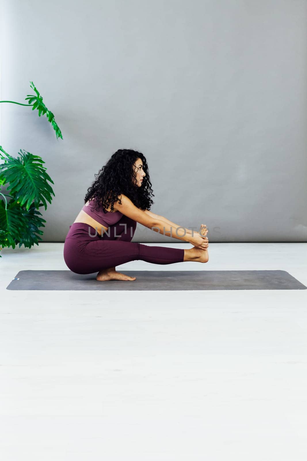 woman yoga asana engaged in fitness gym