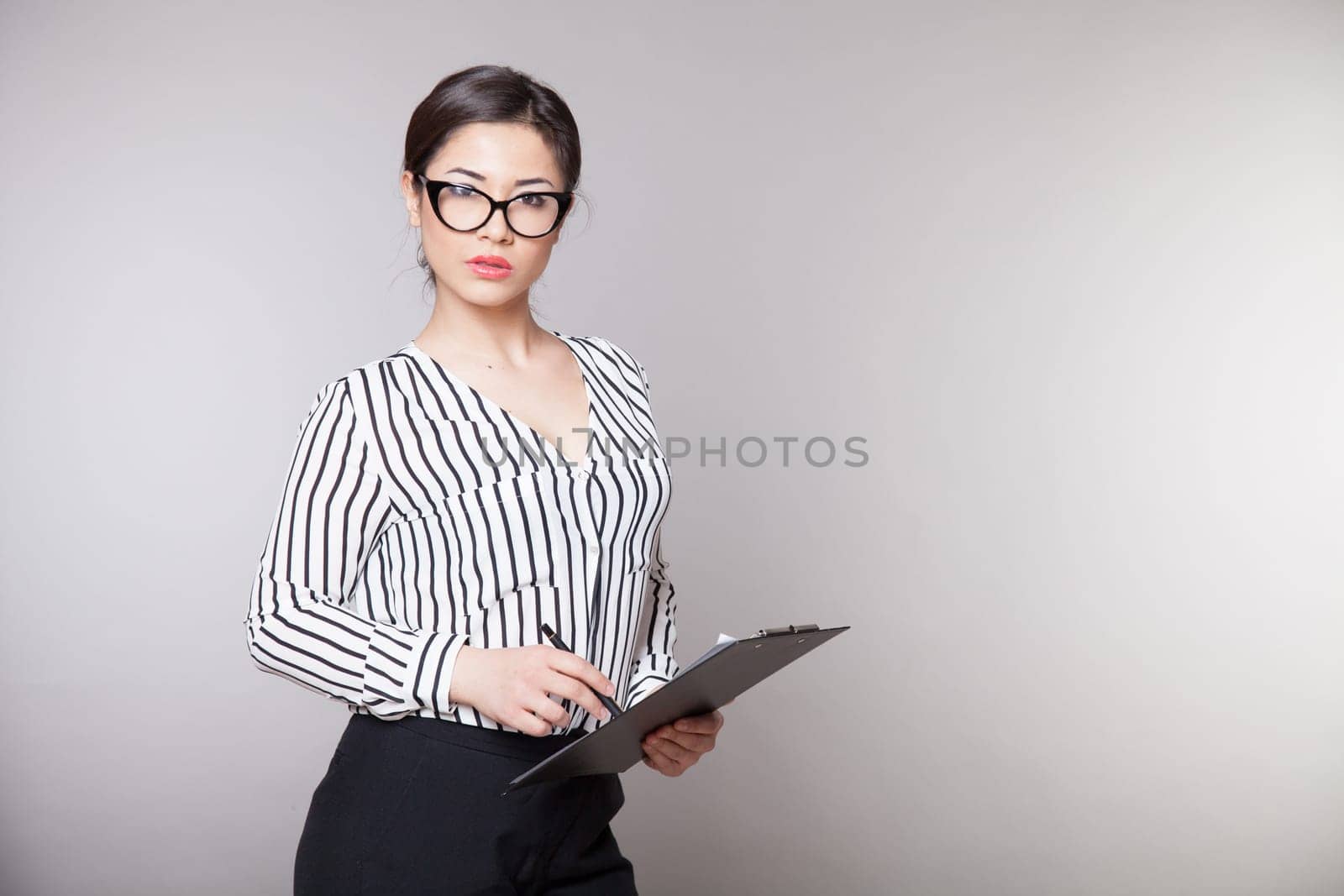 business girl in glasses sits in the Office 1