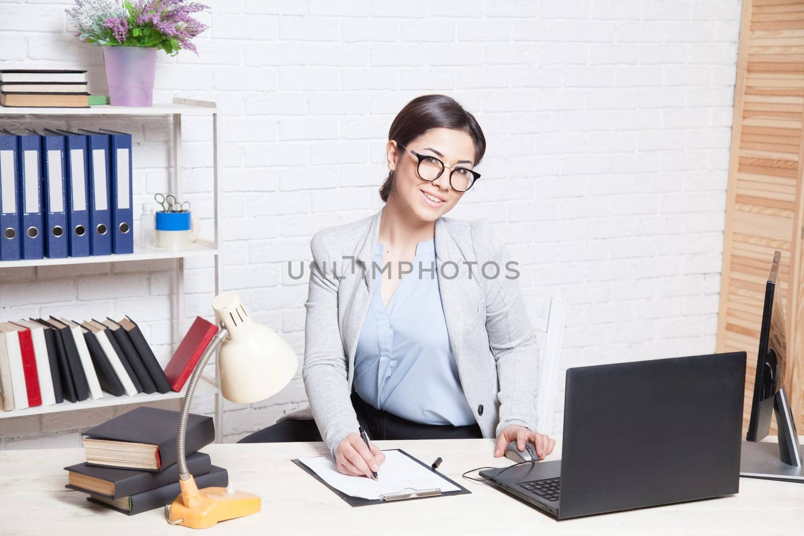 business girl works at a computer in the Office 1