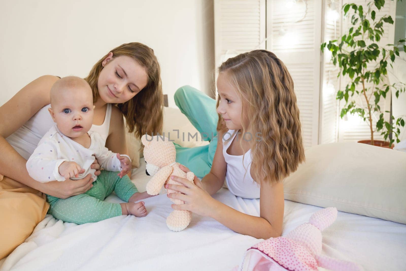 three sisters girl babe in the bedroom on the bed