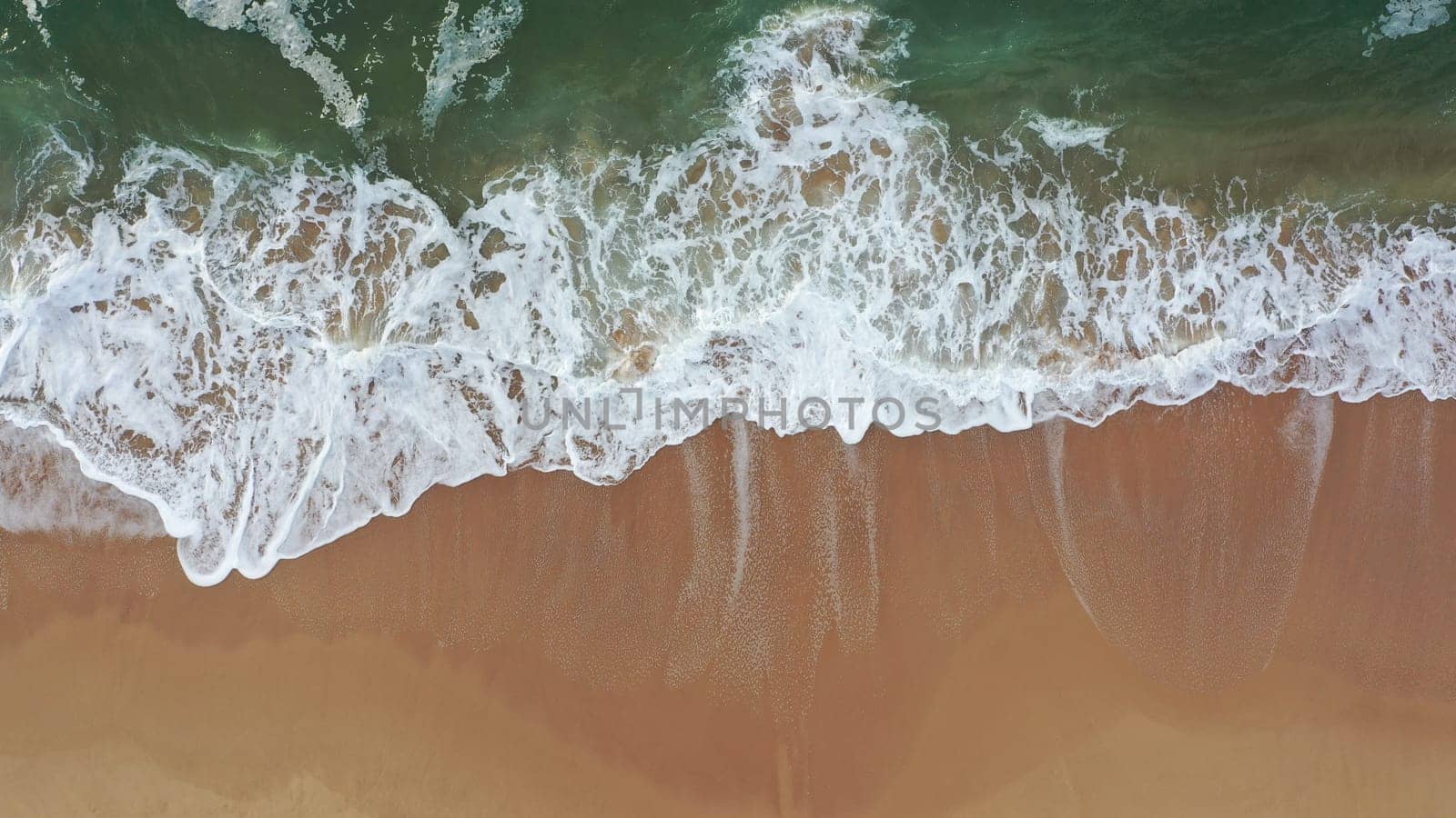 Sea wave on beach aerial view by andreonegin