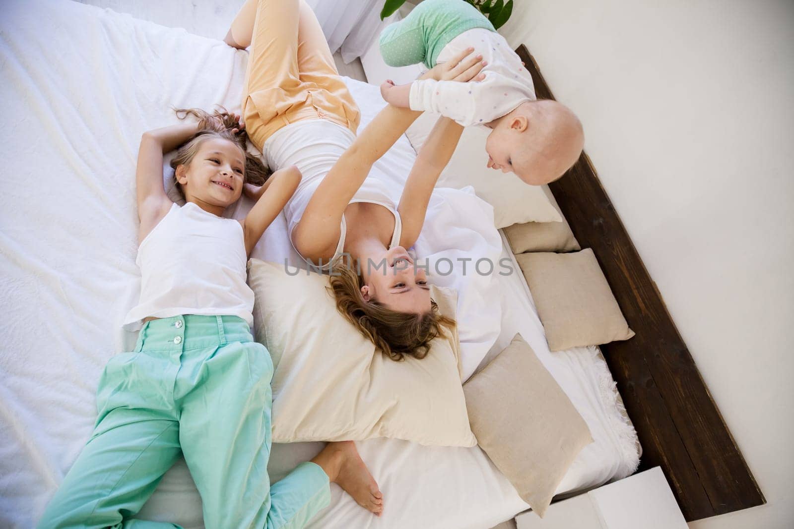 children of three sisters in the morning on the bed in the bedroom 1