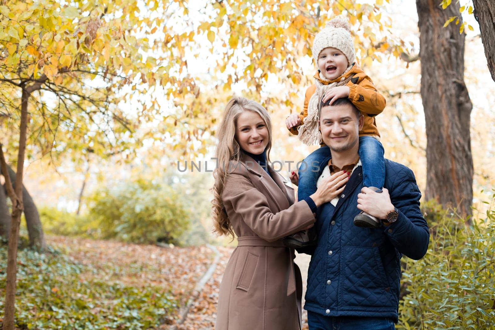 family to boys walk on autumn Woods 1