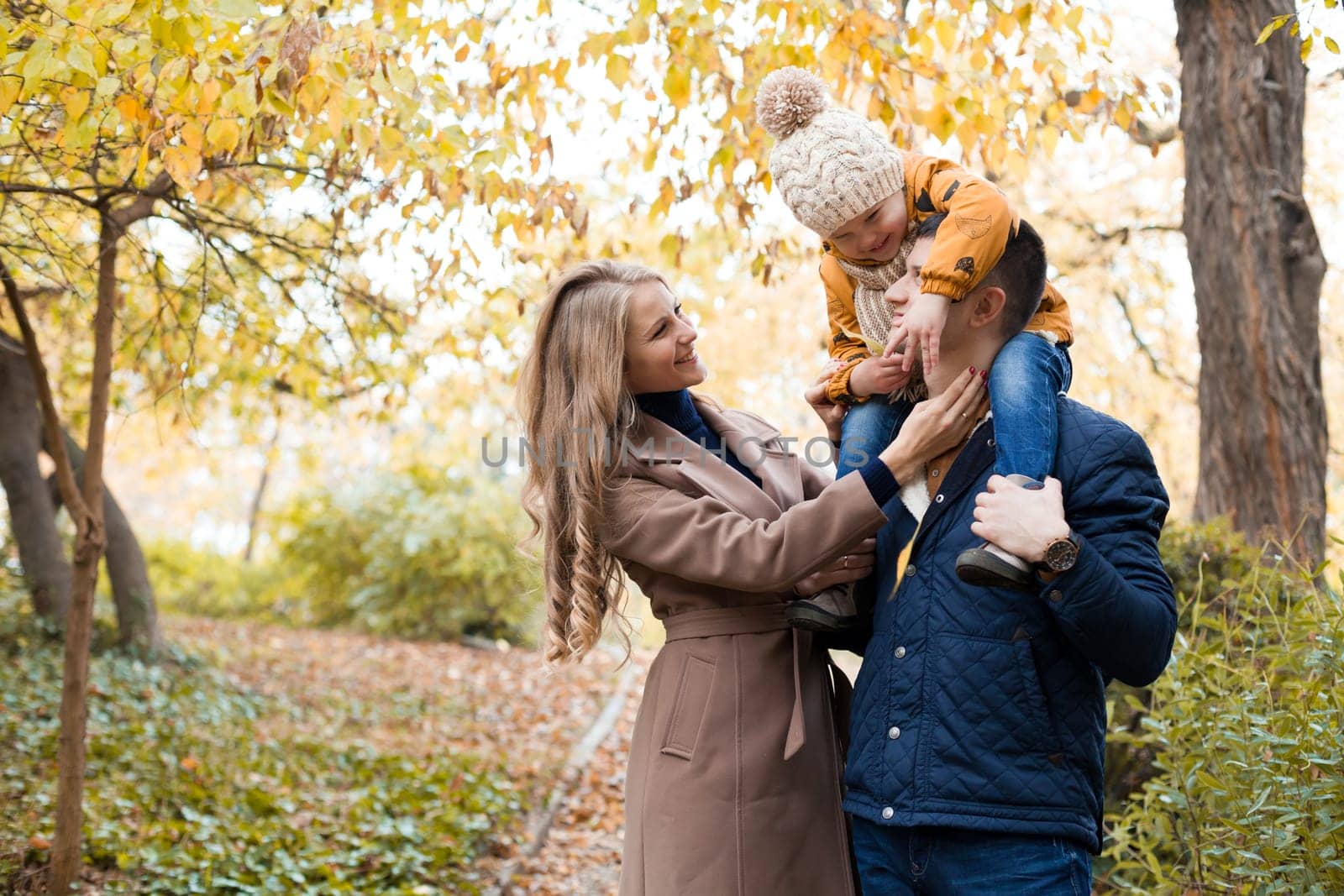 family to boys walk on autumn Woods 1