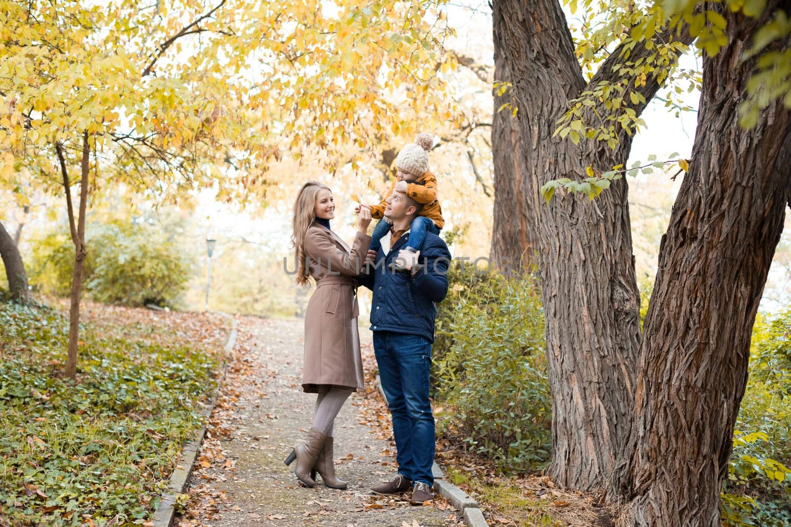 family to boys walk on autumn Woods 1