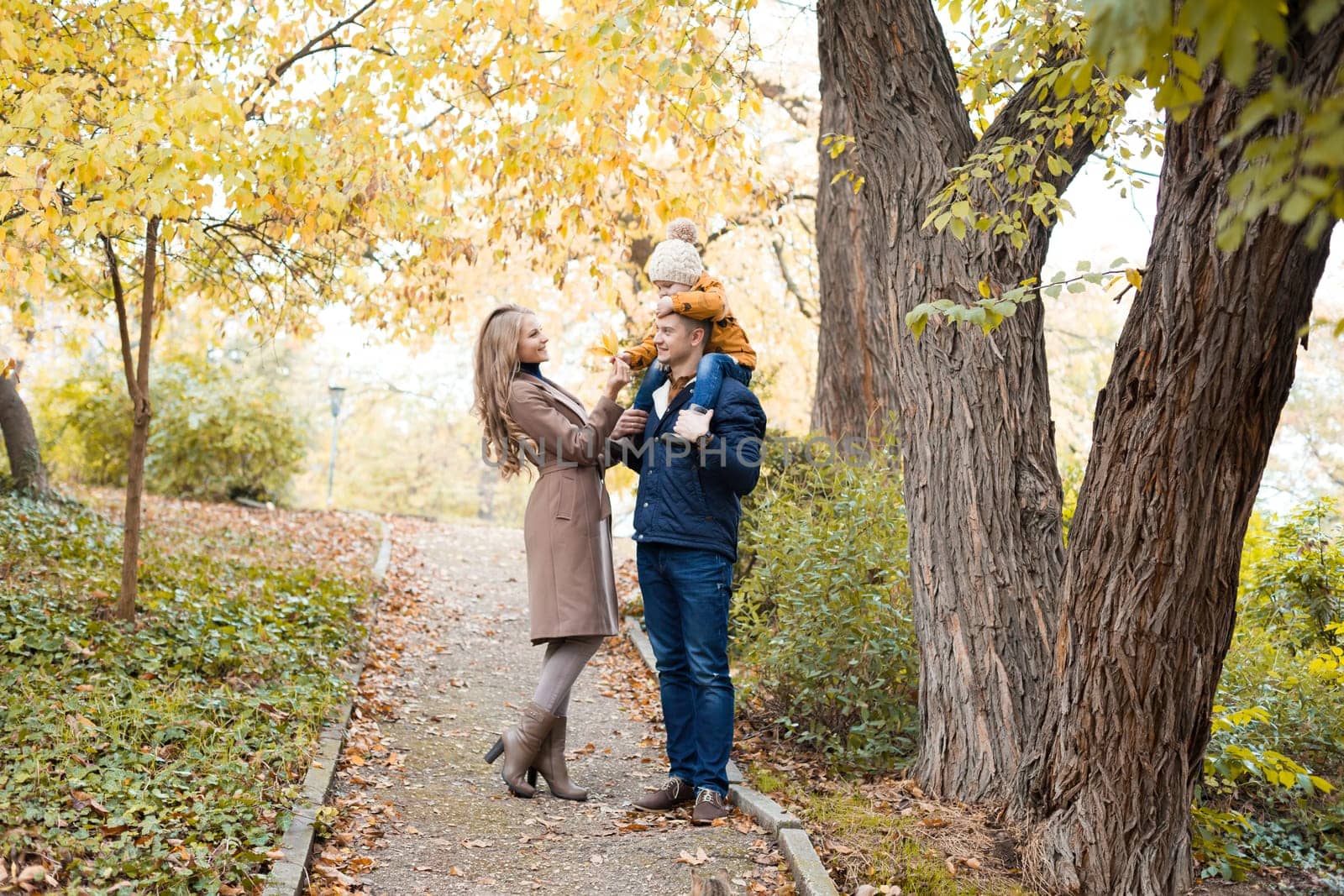 family to boys walk on autumn Woods 1