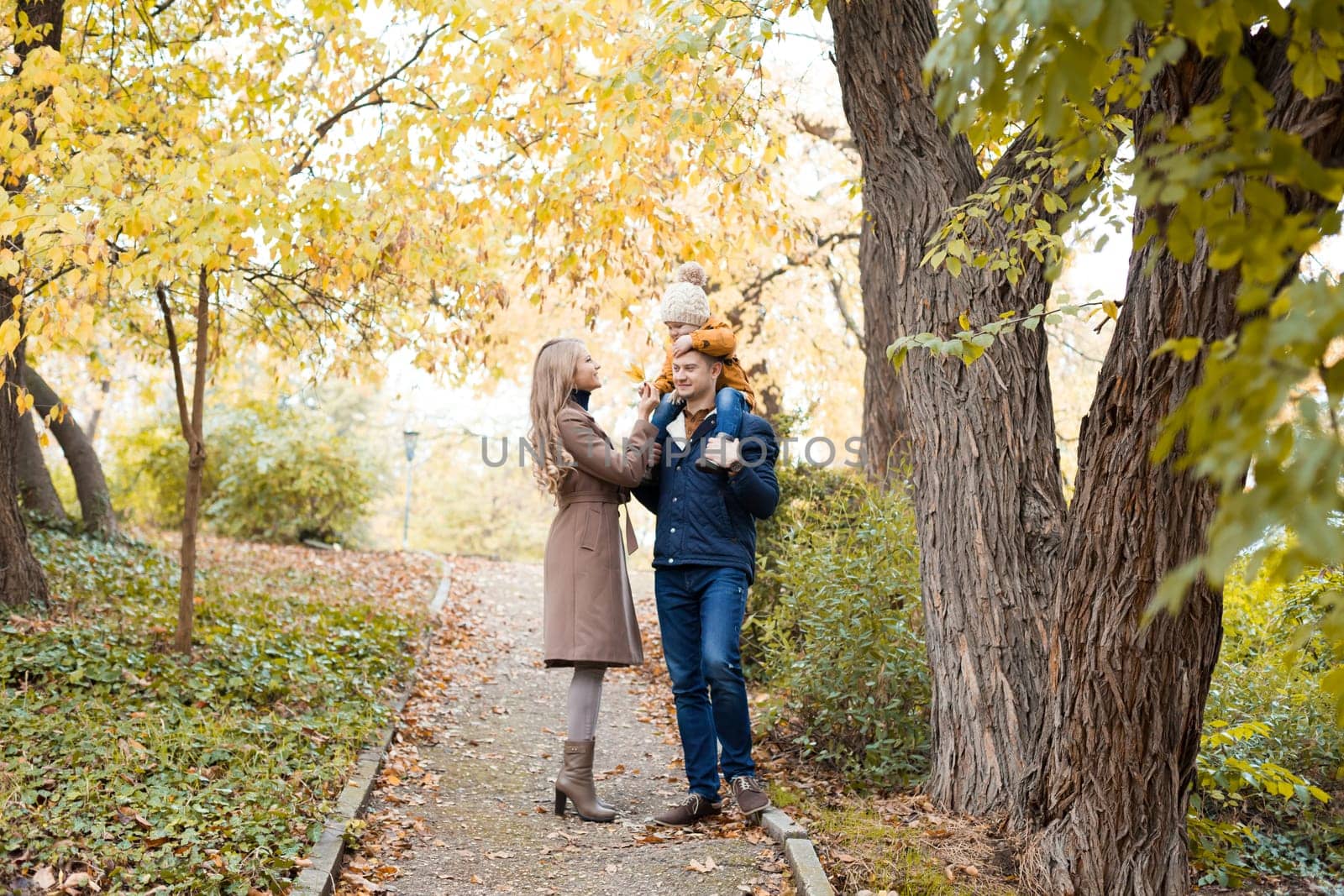 family to boys walk on autumn Woods 1