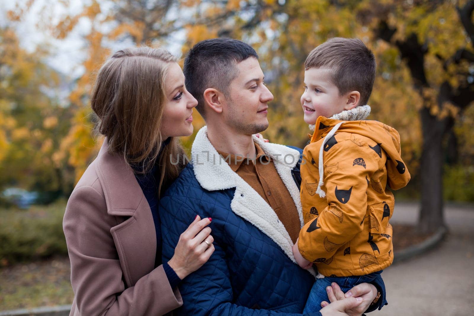 family mom dad son portrait with happiness in the forest 1