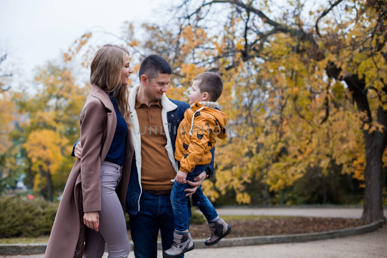 family mom dad son portrait with happiness in the forest 1