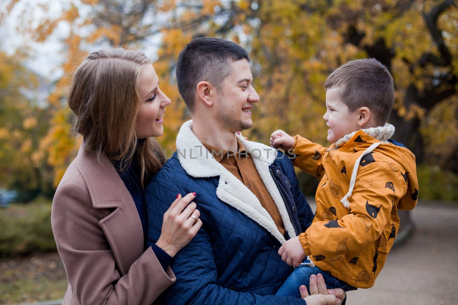 family mom dad son portrait with happiness in the forest 1