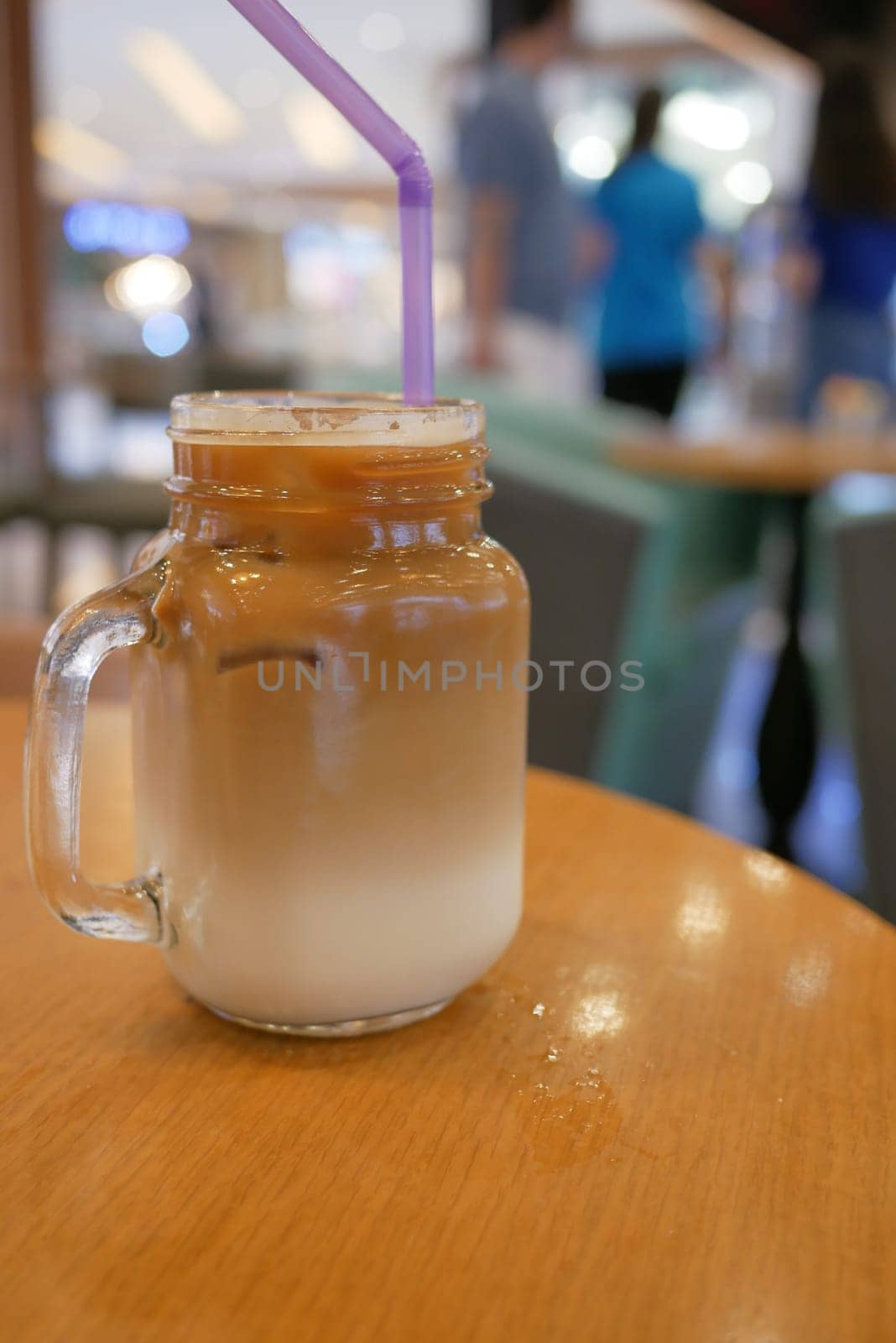 iced late in a transparent glass on cafe table outdoor by towfiq007