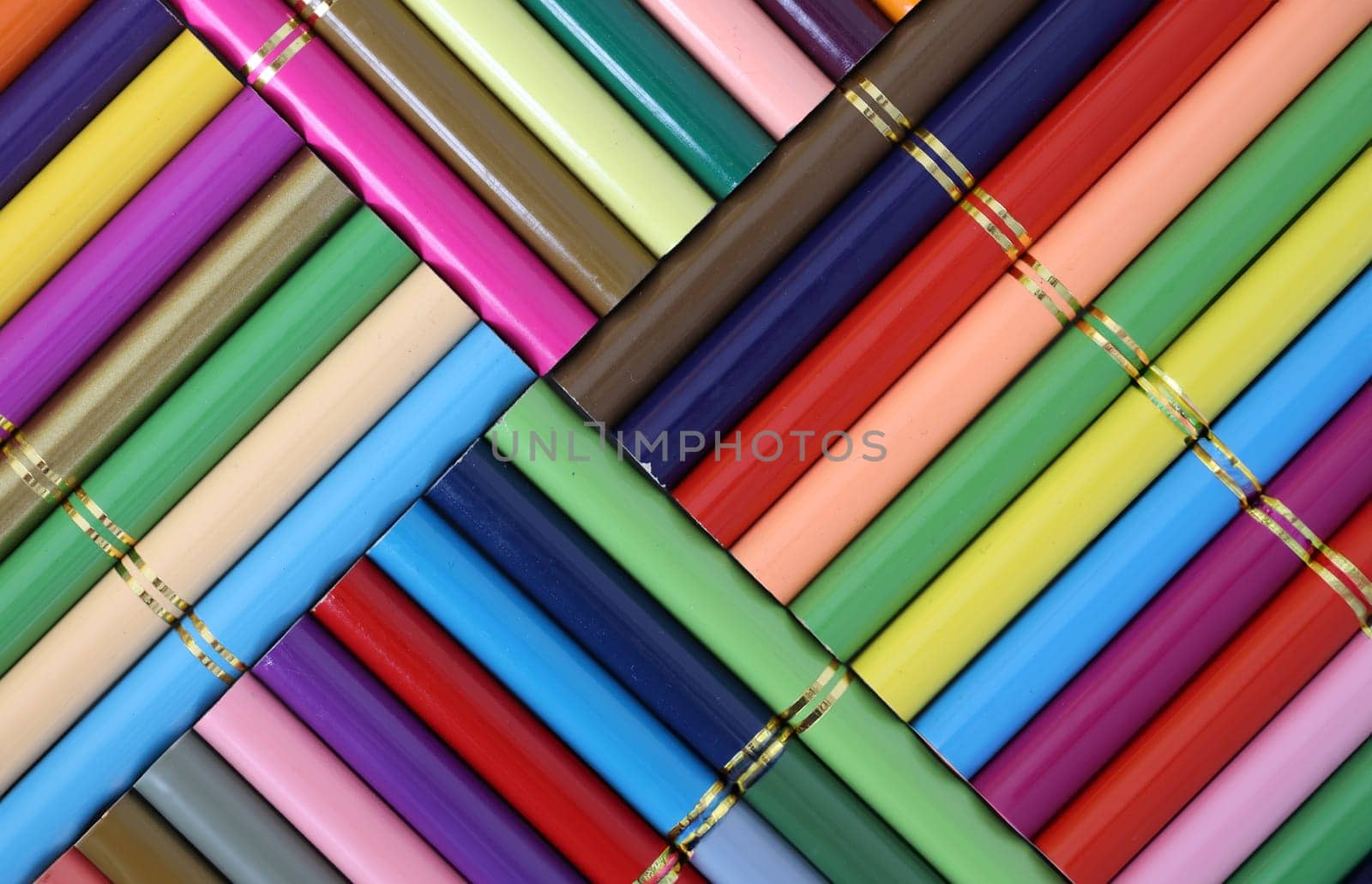 Composition of set of wooden colored pencils in geometric shape. Colored pencils for drawing concept