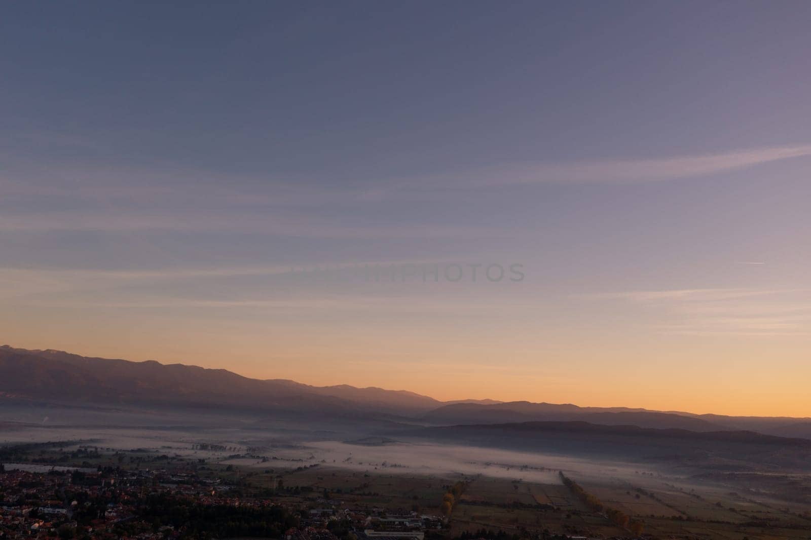 aerial view of foggy morning autumn mountains with clouds bansko bulgaria.