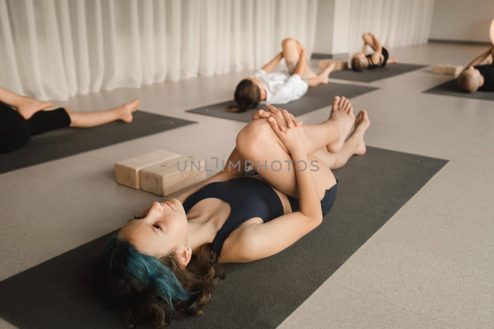 Children do Yoga in the fitness room. Children's gymnastics by Lobachad