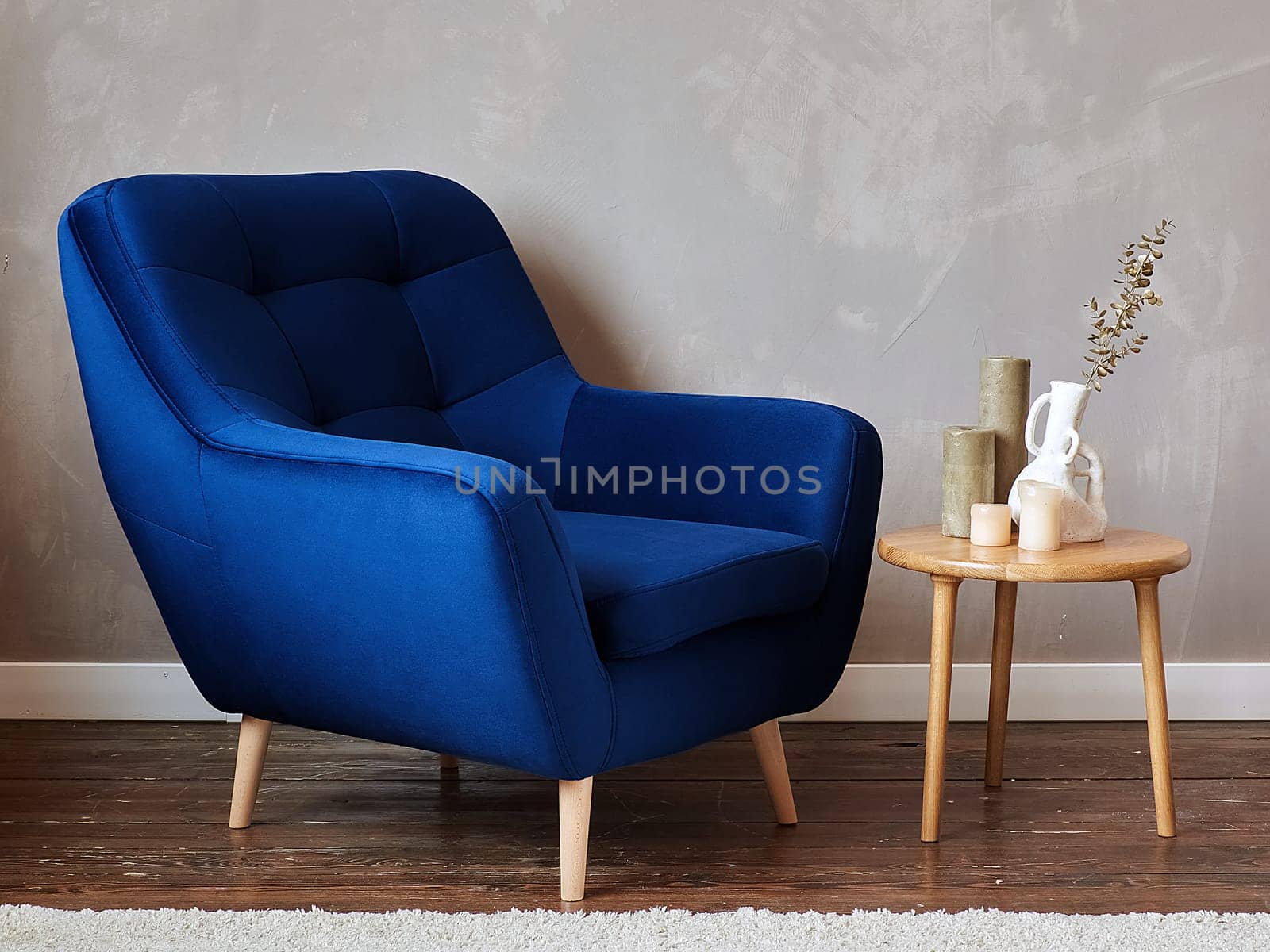 furniture, interior, home design. modern blue fabric armchair with wooden legs, side view