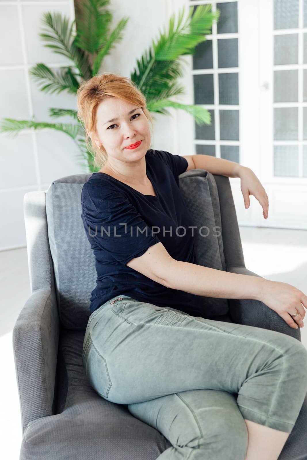 Woman in home clothes drying on chair