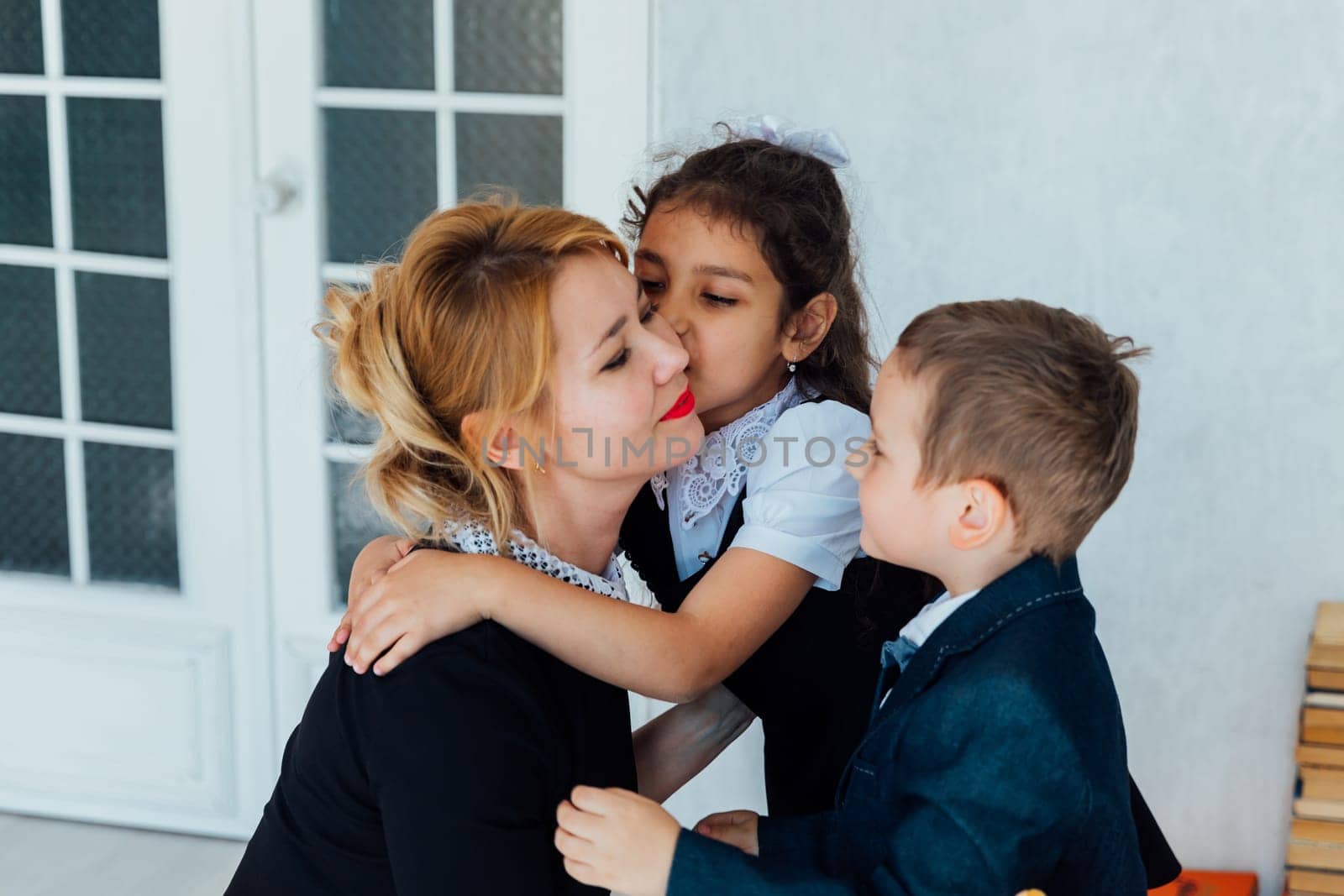 Kids boy and girl congratulating on teacher's