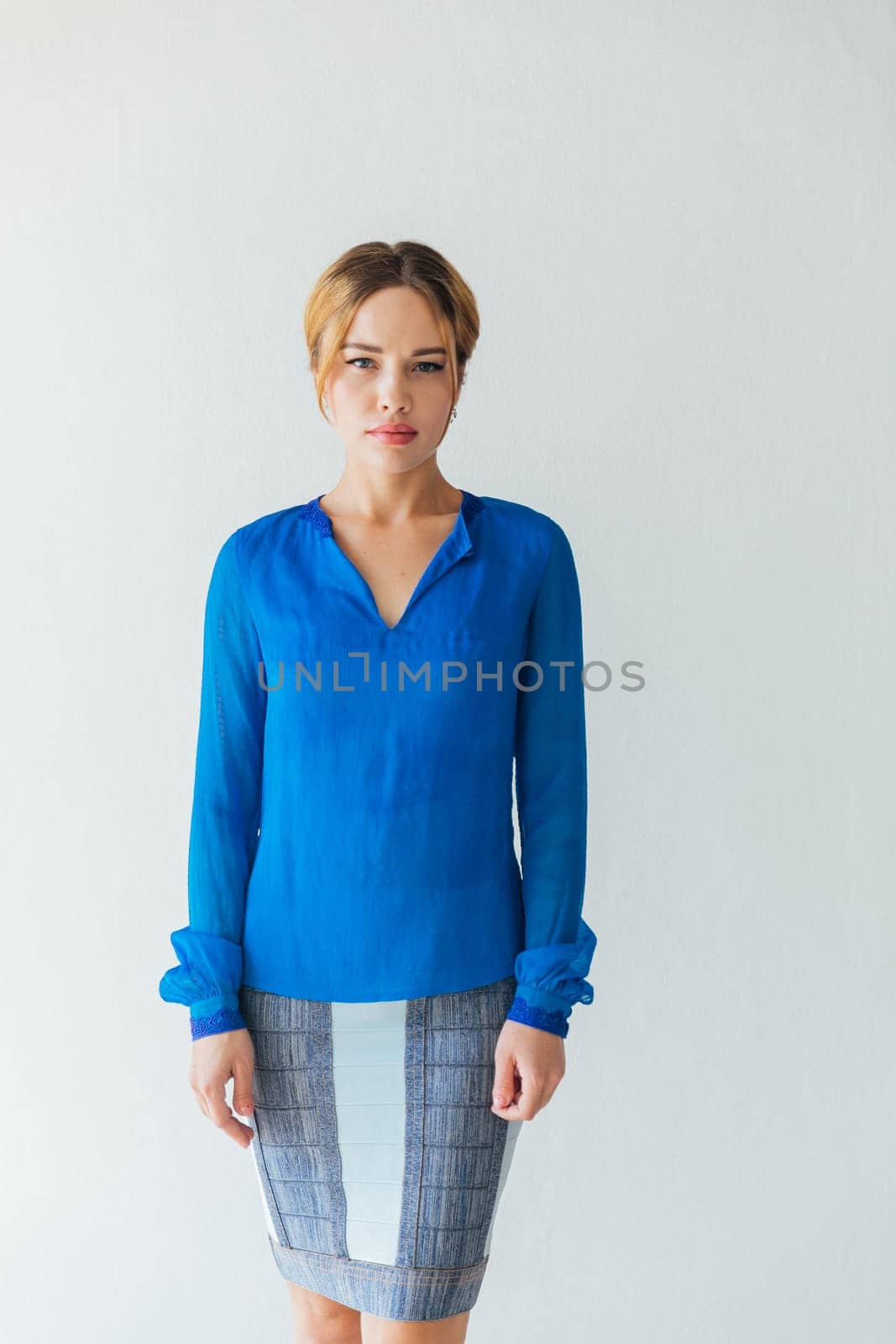 woman in blue clothes on white background