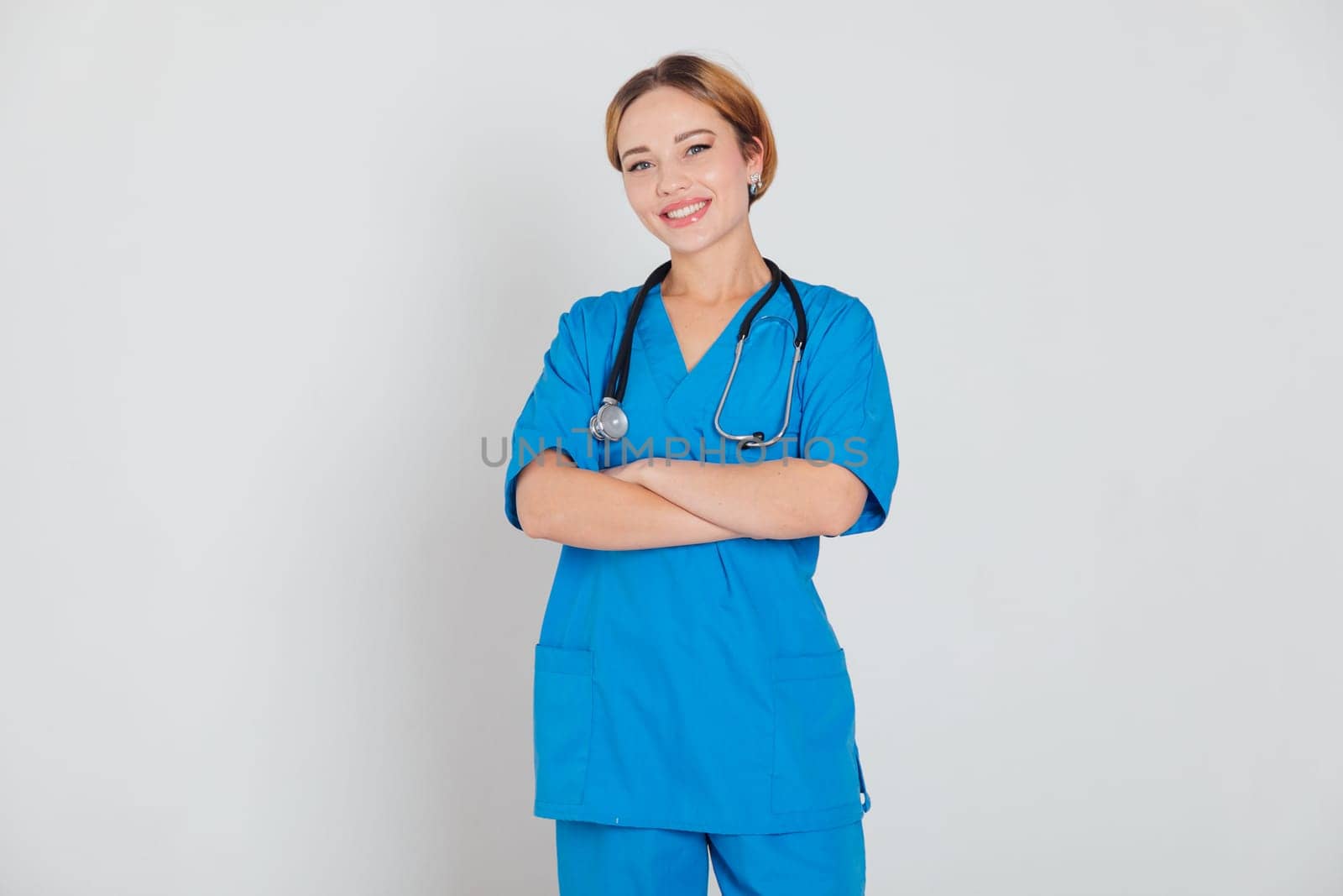 Female doctor with stethoscope on white background