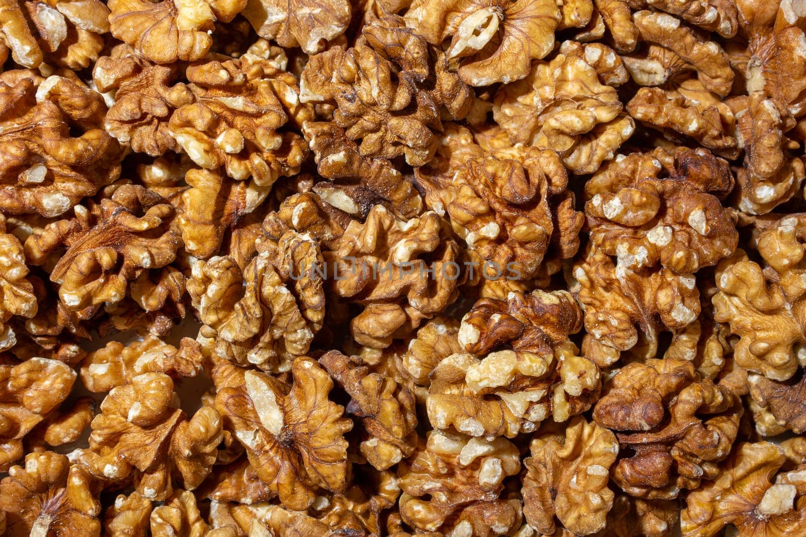 Scattered Shelled Walnuts. Background from Walnut. Natural High-Calorie Snacks