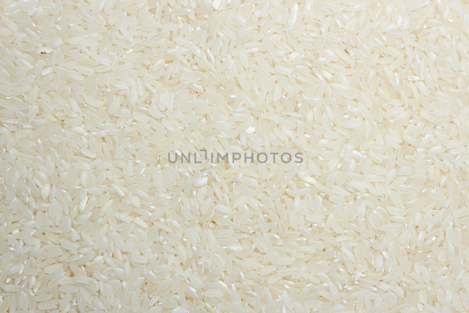 Dry Uncooked White Rice Background by InfinitumProdux