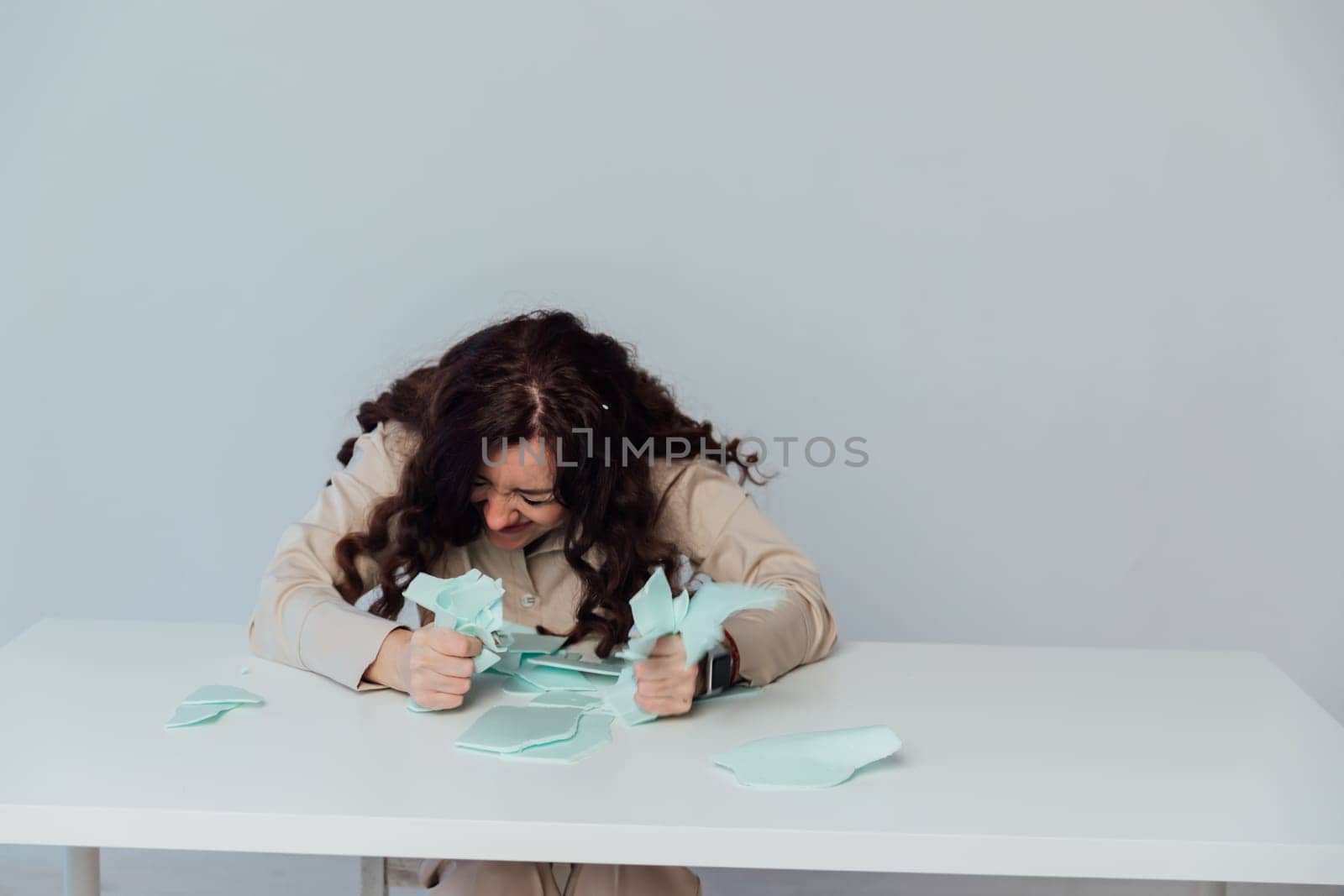 Woman Nervous Freaking Out And Tearing Paper At Table