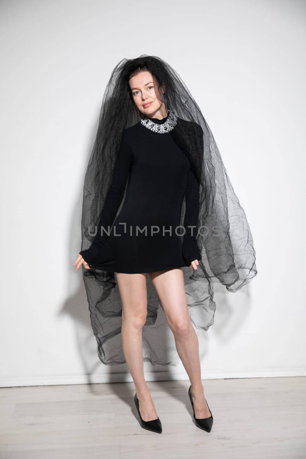 Beautiful bride in black witch wedding dress by Simakov