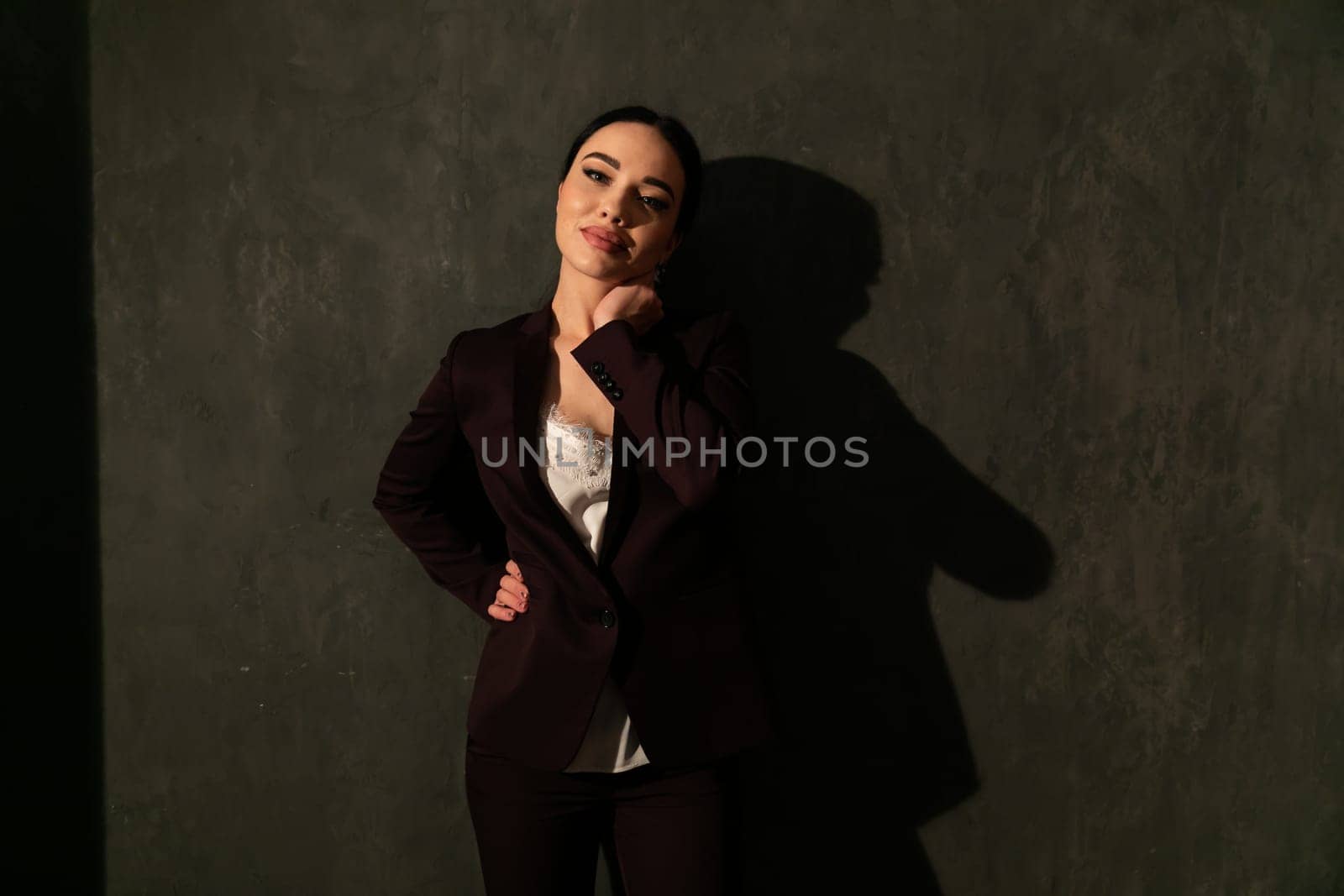 Business woman in brown business suit in office