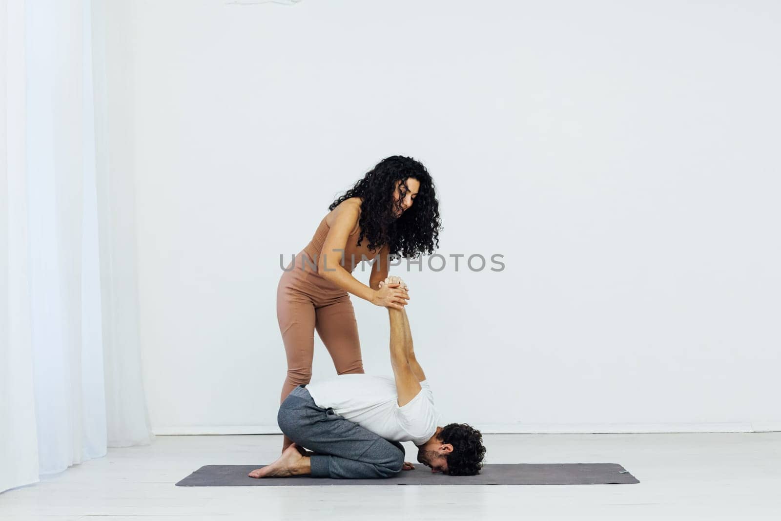 Man And Woman Doing Couple Yoga Fitness Gymnastics