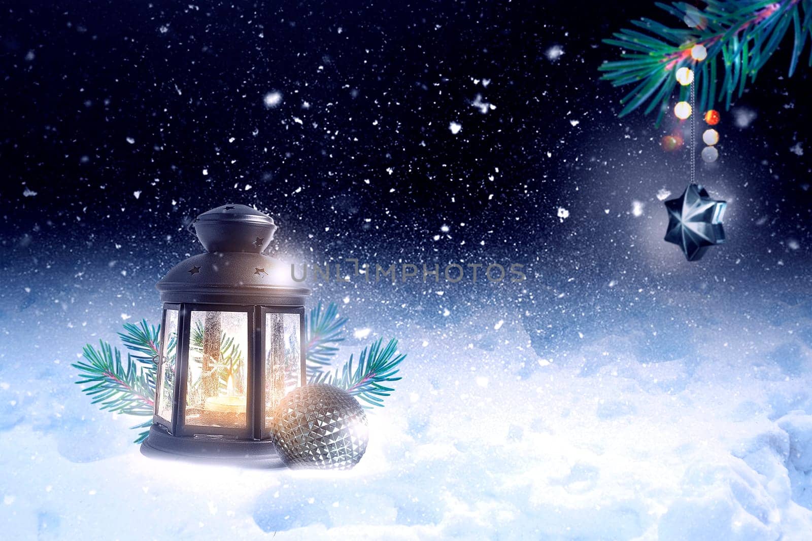 Christmas Lantern in the snow and toy hangs on spruce branches at winter night.