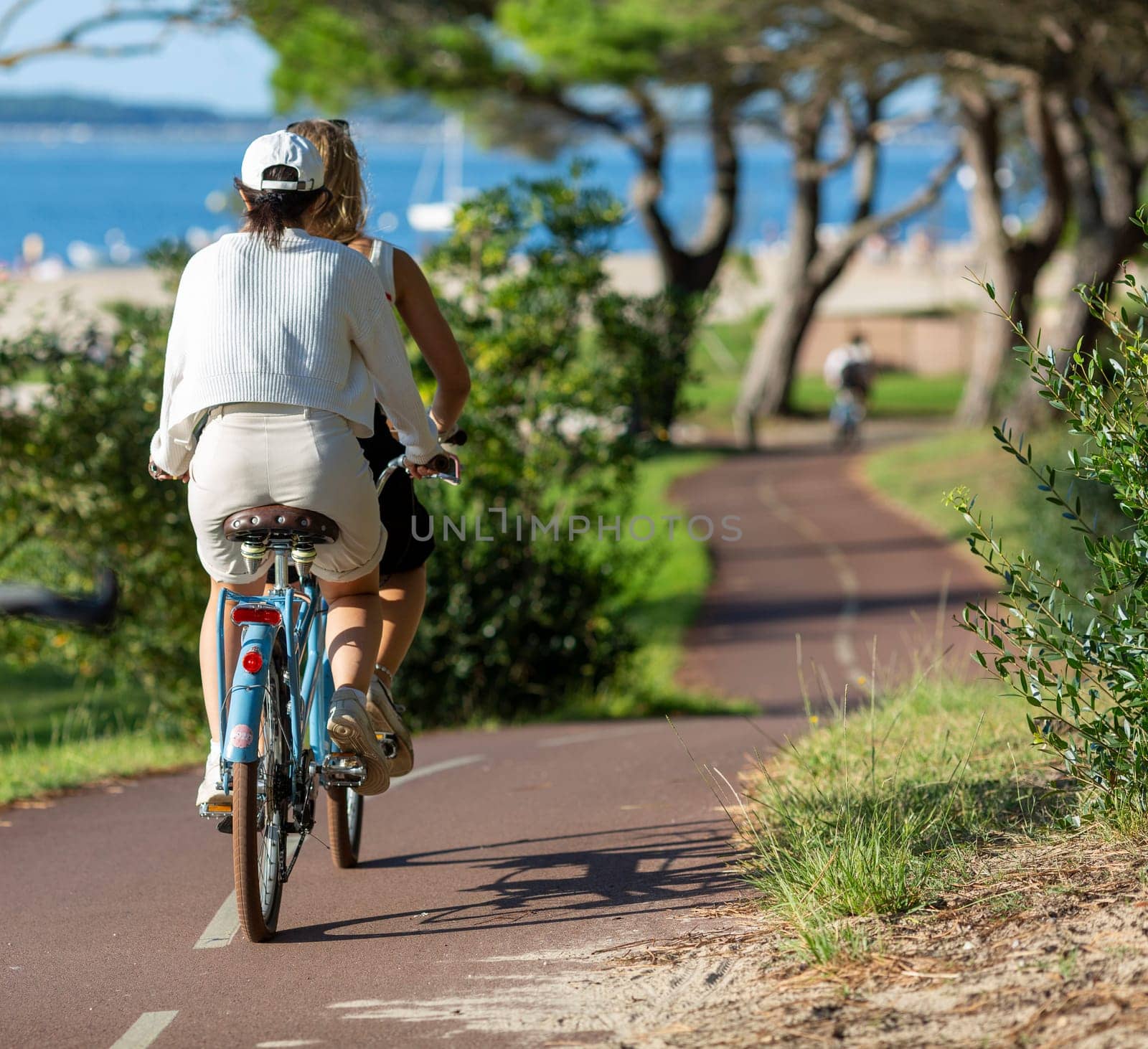 Person riding a bicycle on a cycle path a sunny day