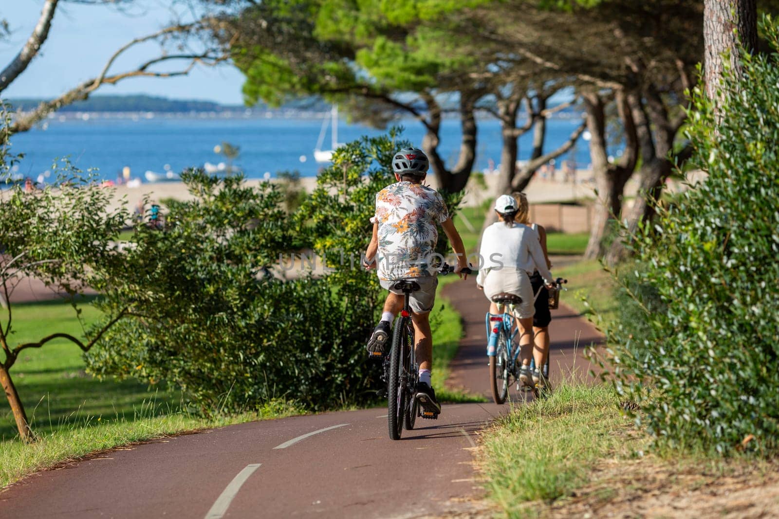 Person riding a bicycle on a cycle path a sunny day