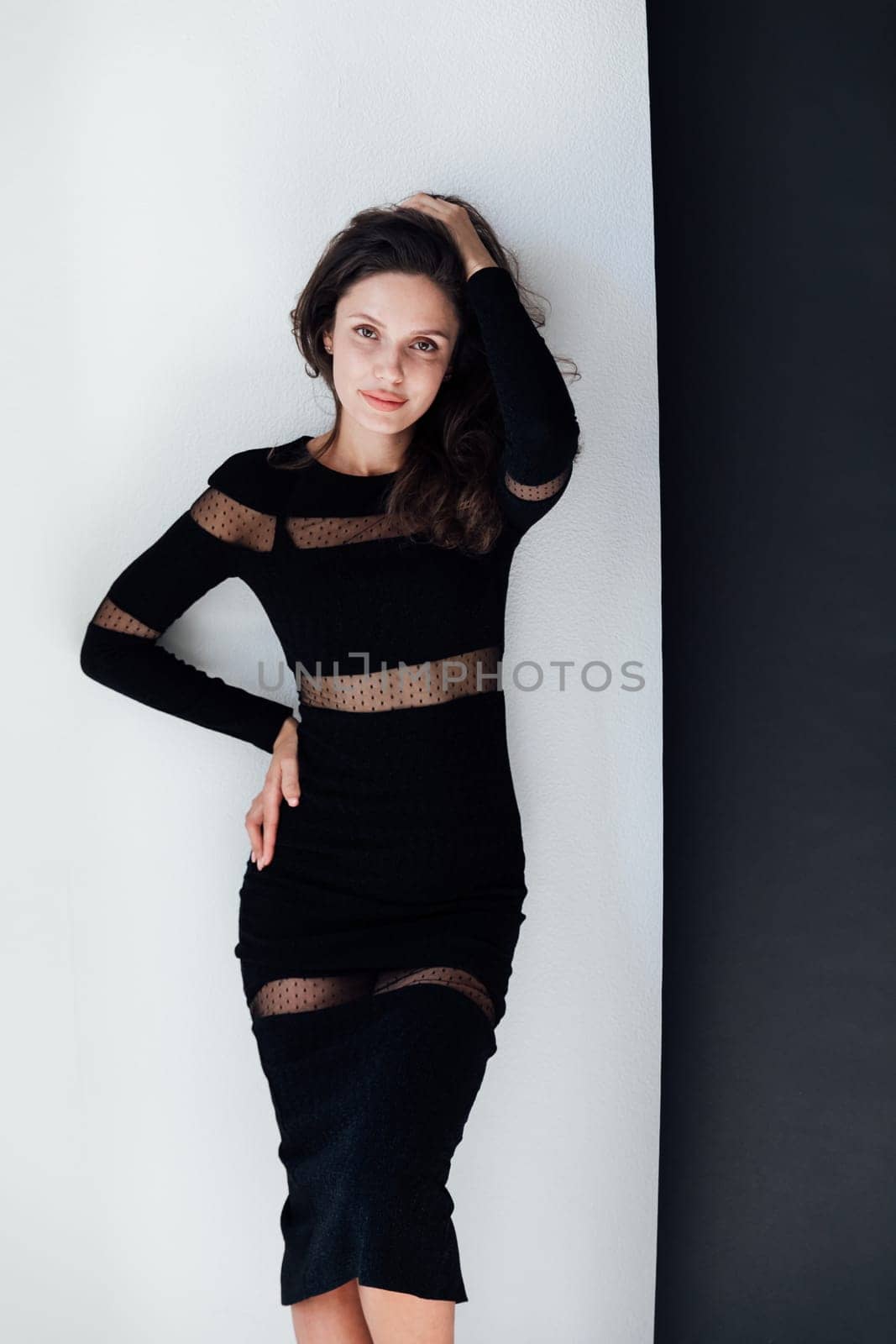 Portrait of brunette woman in black business evening dress by Simakov