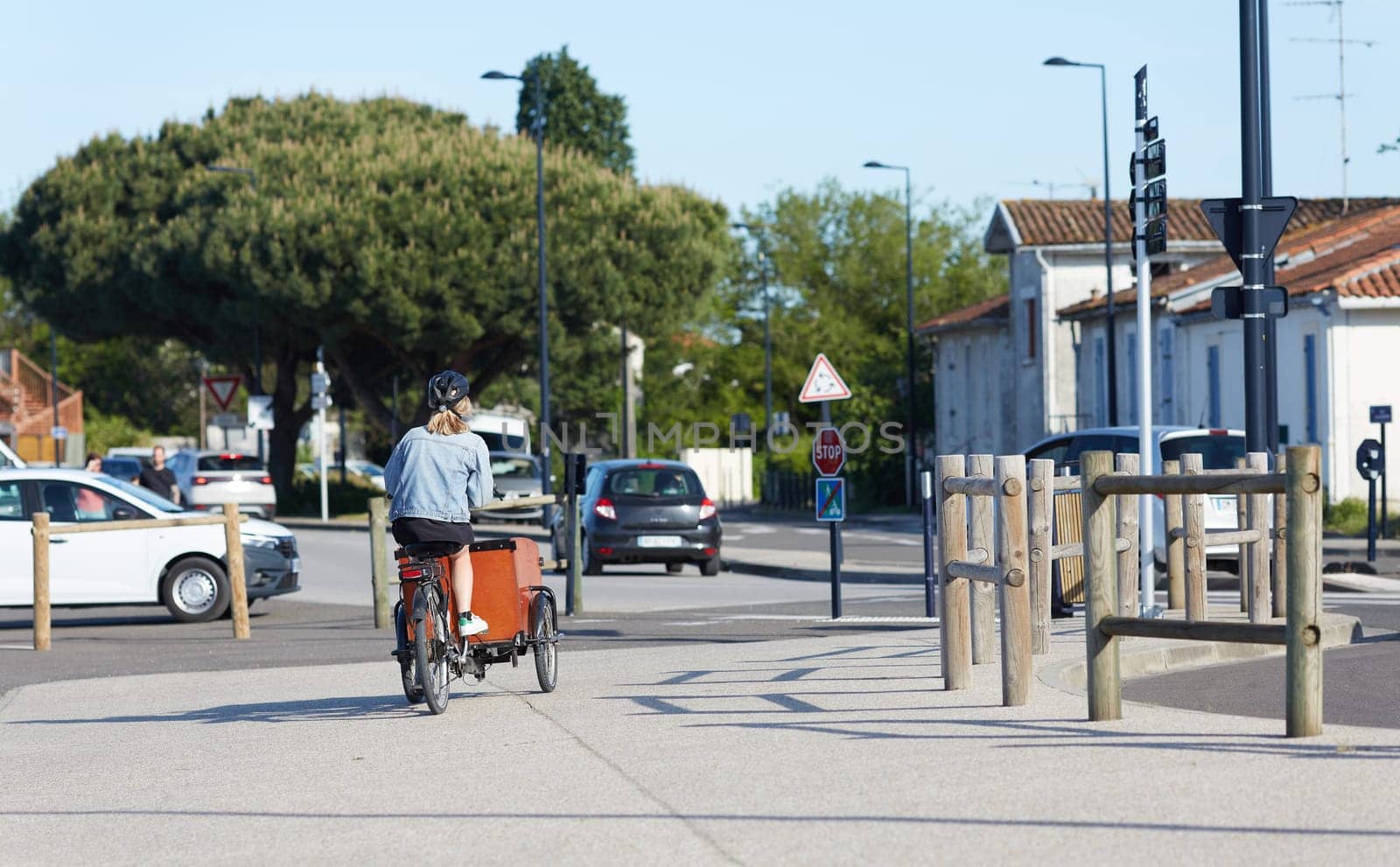 Person riding a bicycle on a cycle path a sunny day