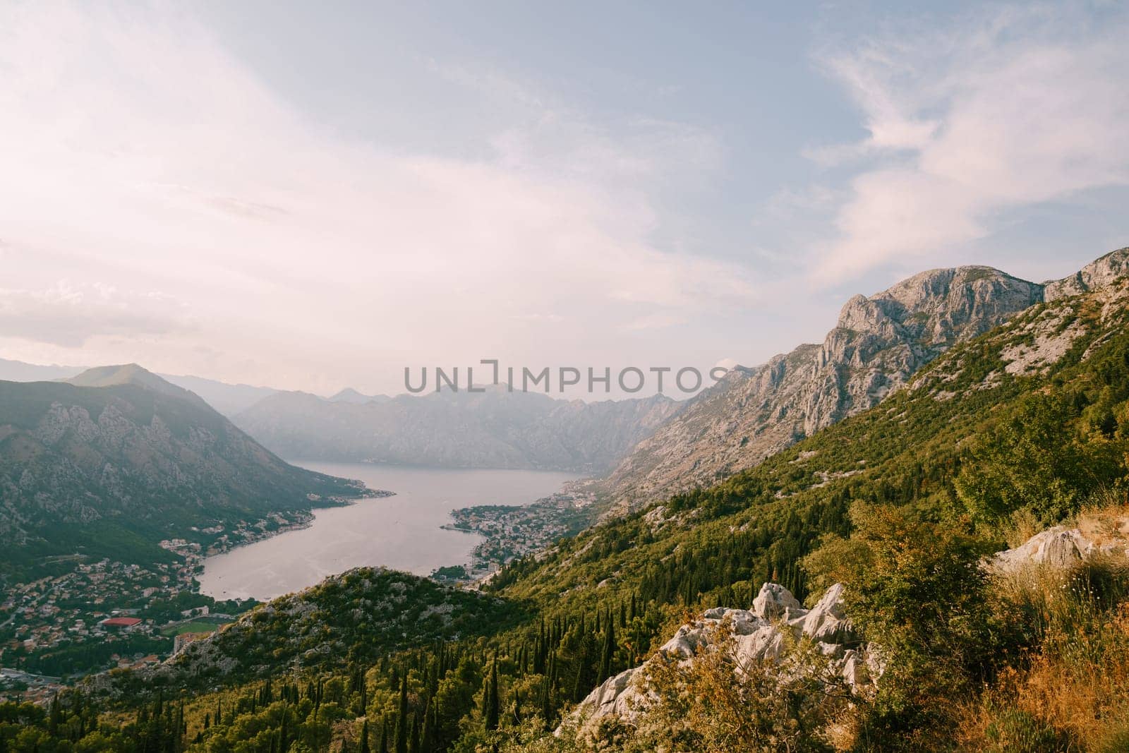 View from the mountain to the Bay of Kotor, surrounded by a mountain range. Montenegro. High quality photo