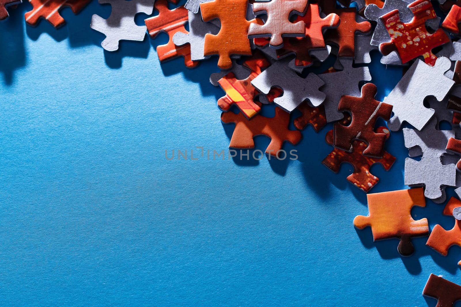 Colorful Jigsaw Puzzle on Blue Background by InfinitumProdux